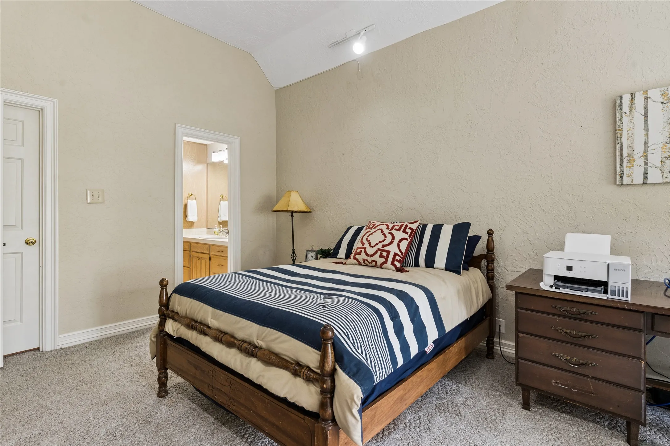 Upstairs bedroom has an ensuite bath and walk-in cedar closet.