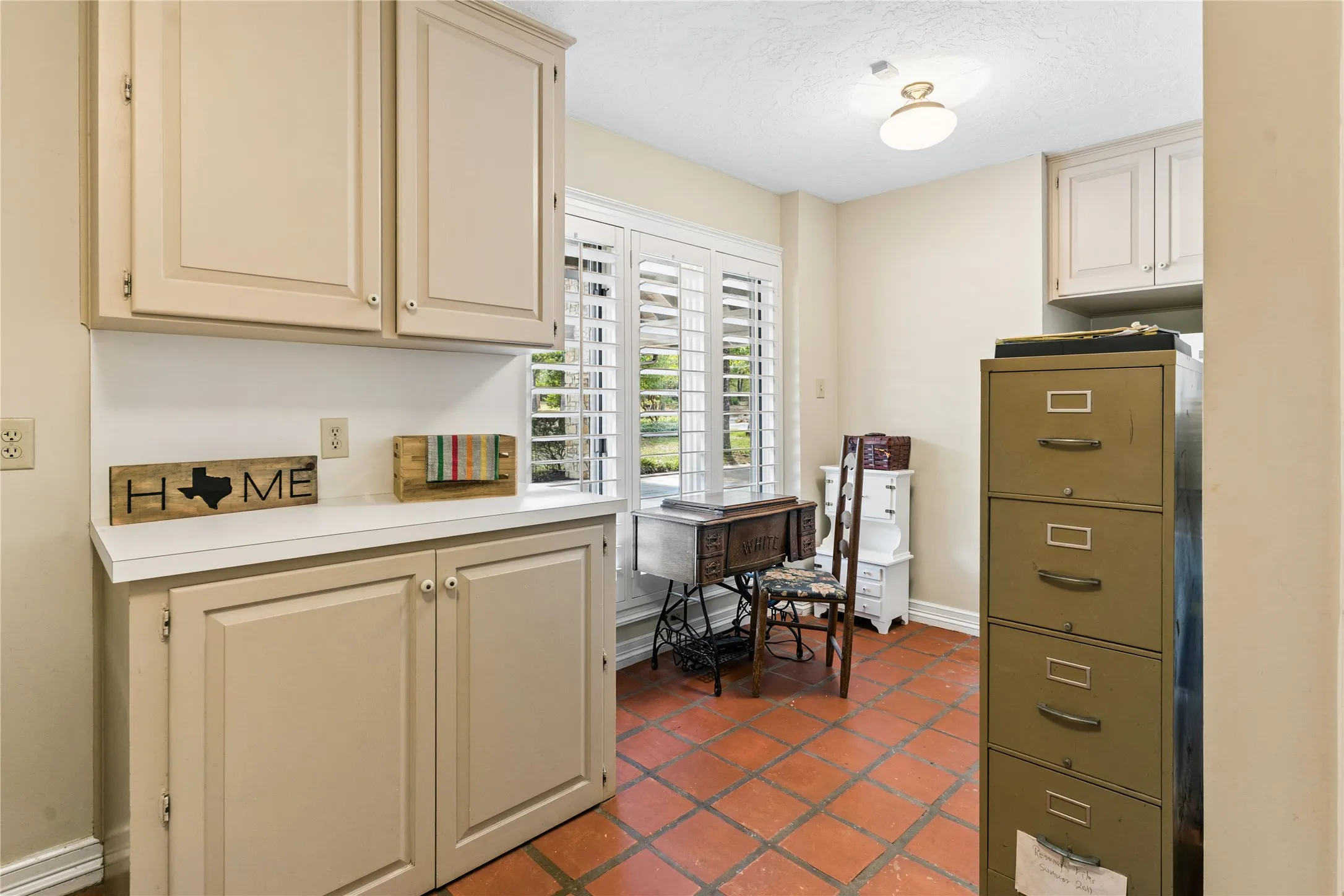 Laundry room has window, sink, walk-in closet, and room for a freezer