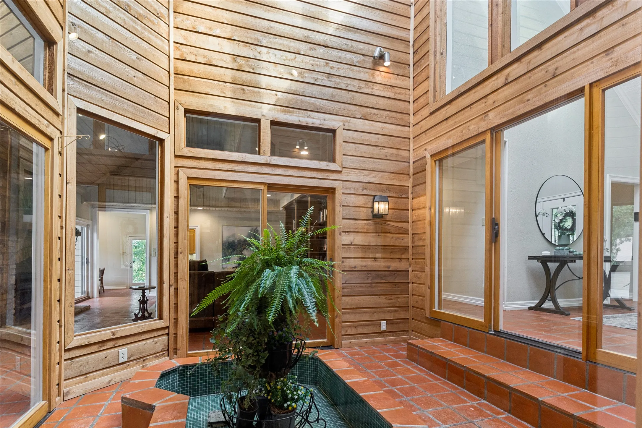 Climate controlled atria in center of home