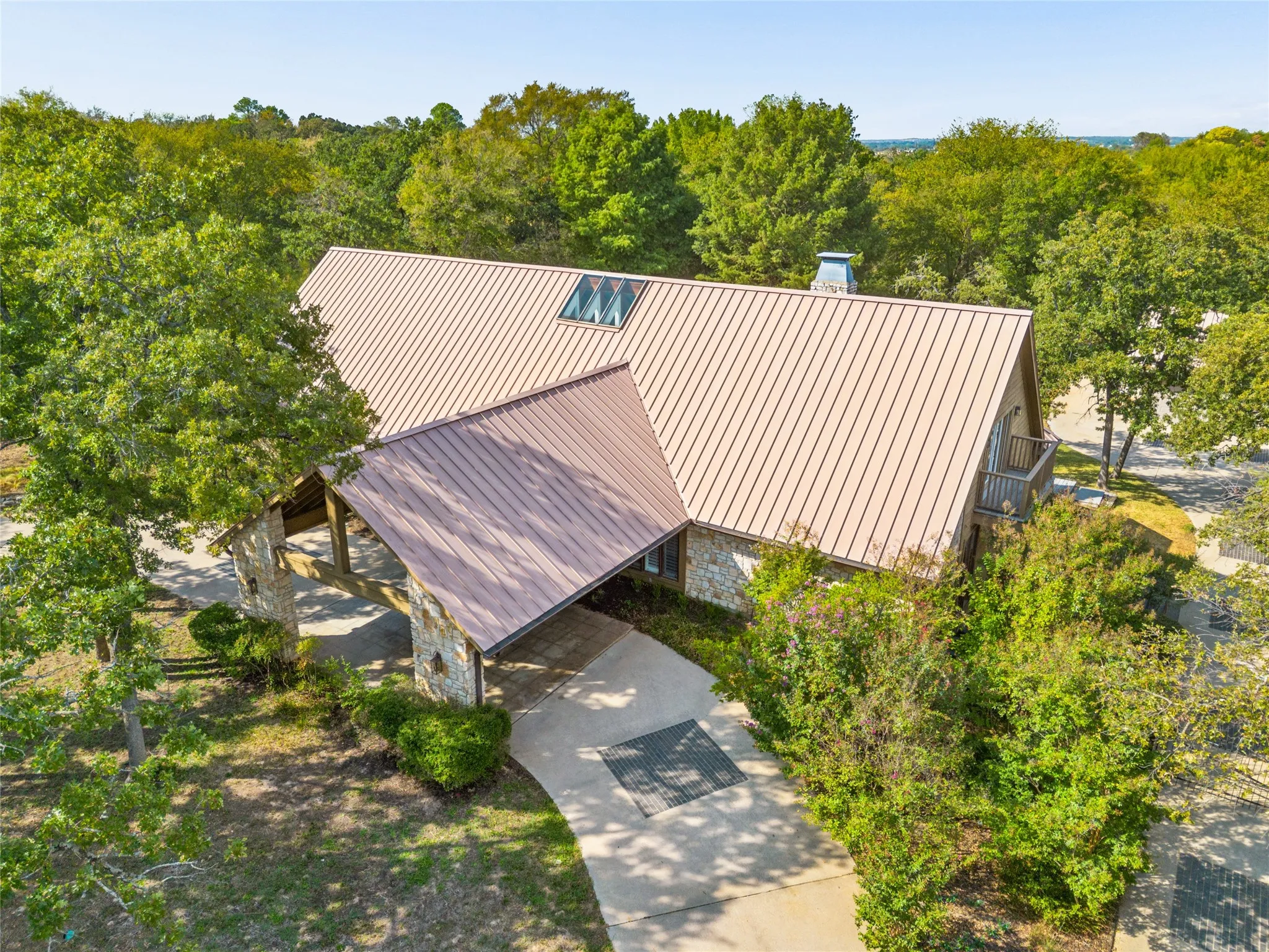 Custom home with metal roof situated on more than 2 acres