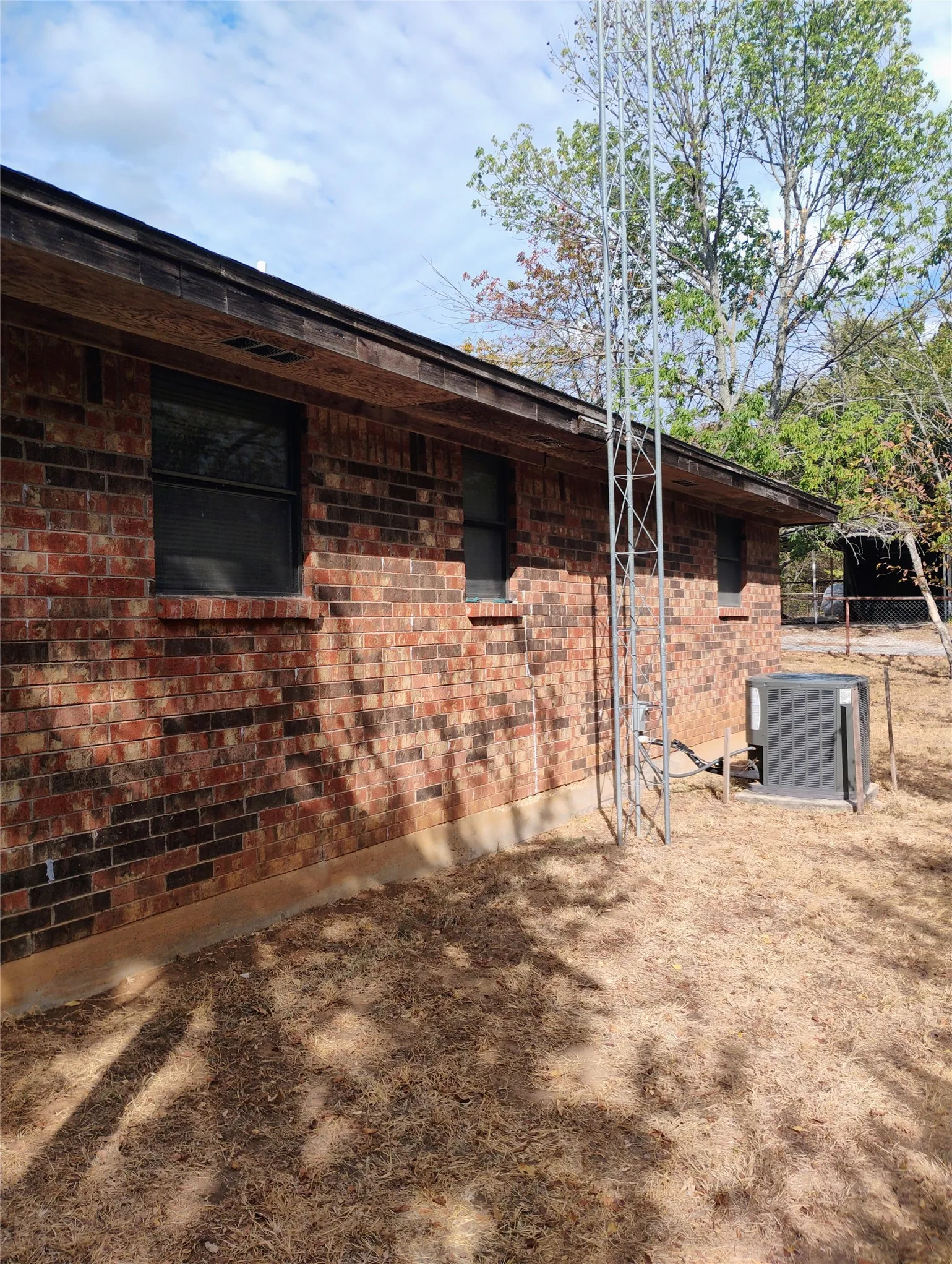 Brick exterior with a brown fascia and soffit