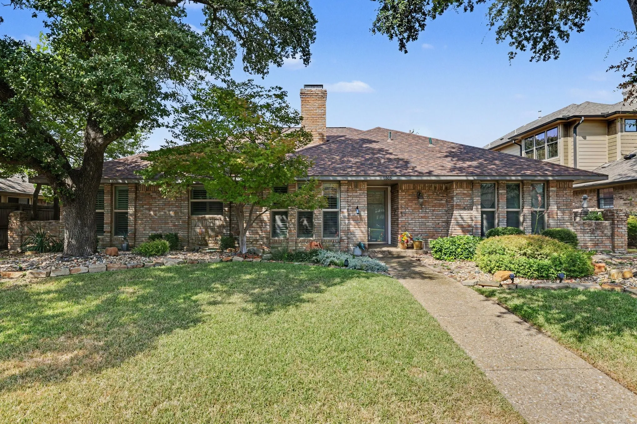 Brick exterior with a gabled roof and prominent chimney