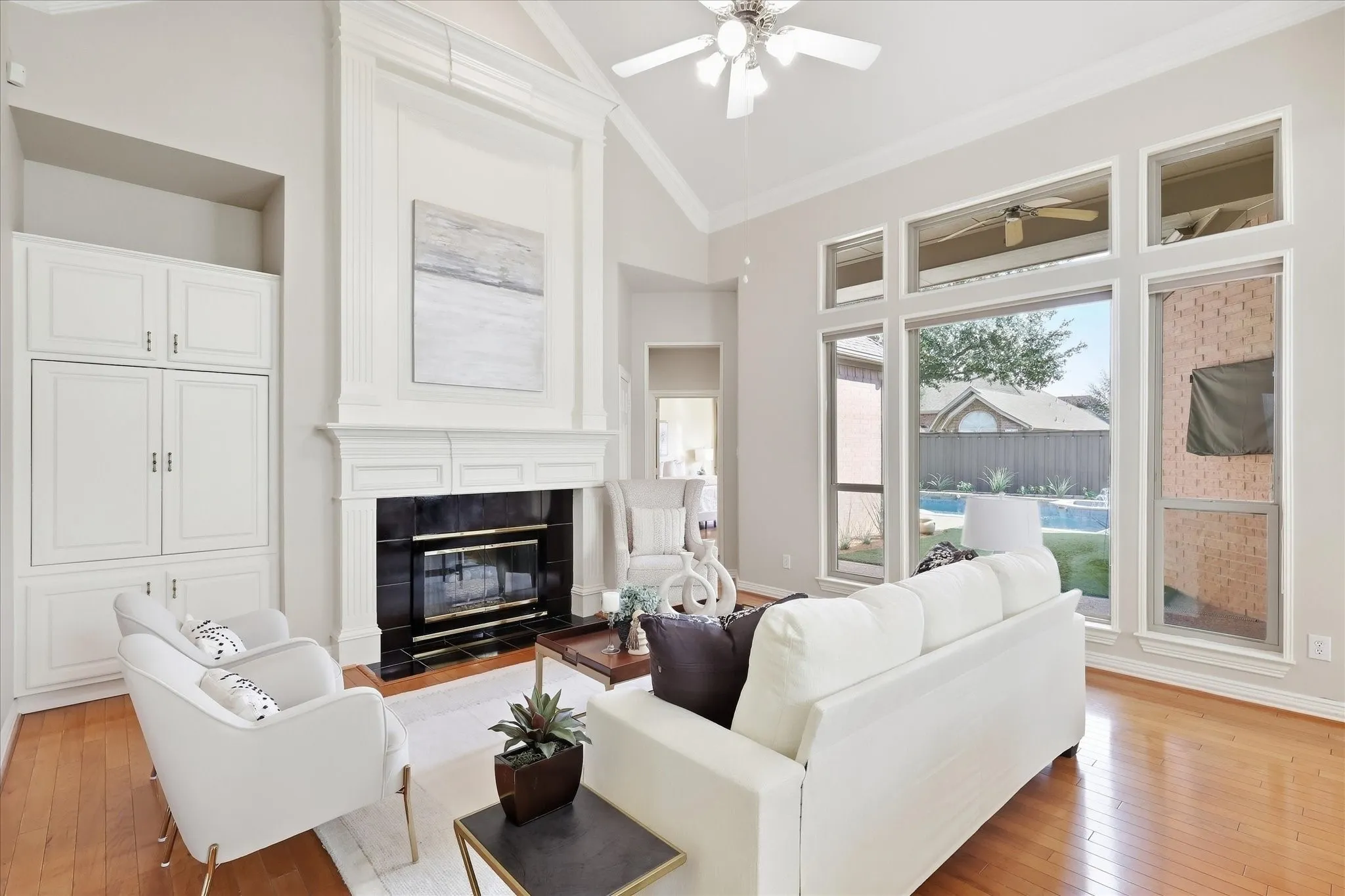 Impressive elements with Built-ins, Expansive Windows, Gorgeous Fireplace & Soaring Ceiling