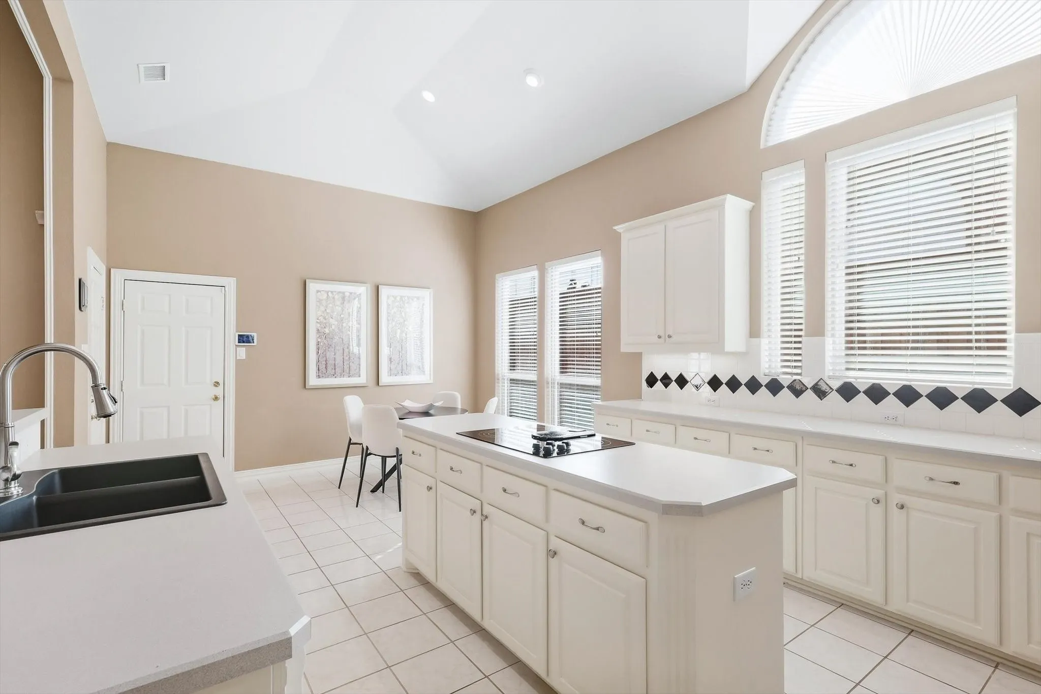 Spacious Island Kitchen with an Abundance of Tall Cabinetry & Prep Space