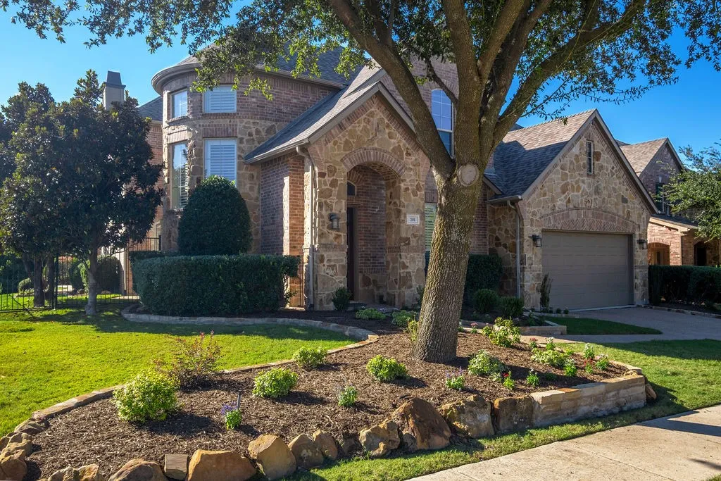 Stone and brick facade with an arched entry