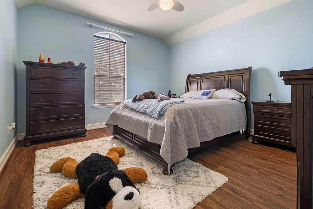 Wood-finish flooring with light blue walls and white trim