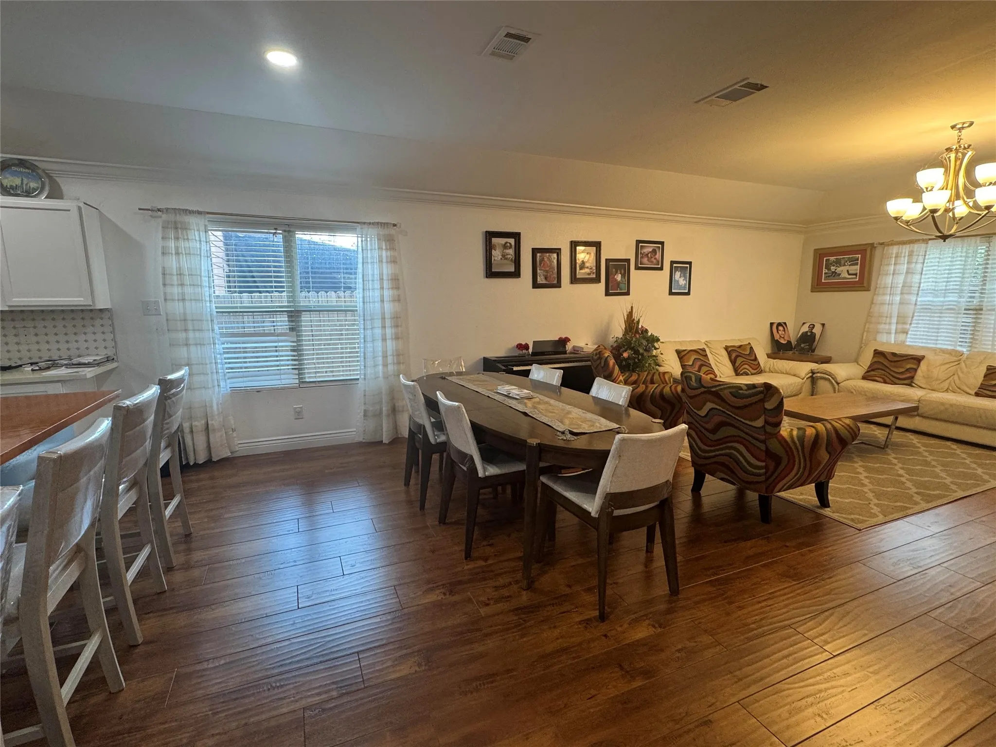 Wood-finish flooring throughout, with recessed lighting and crown molding