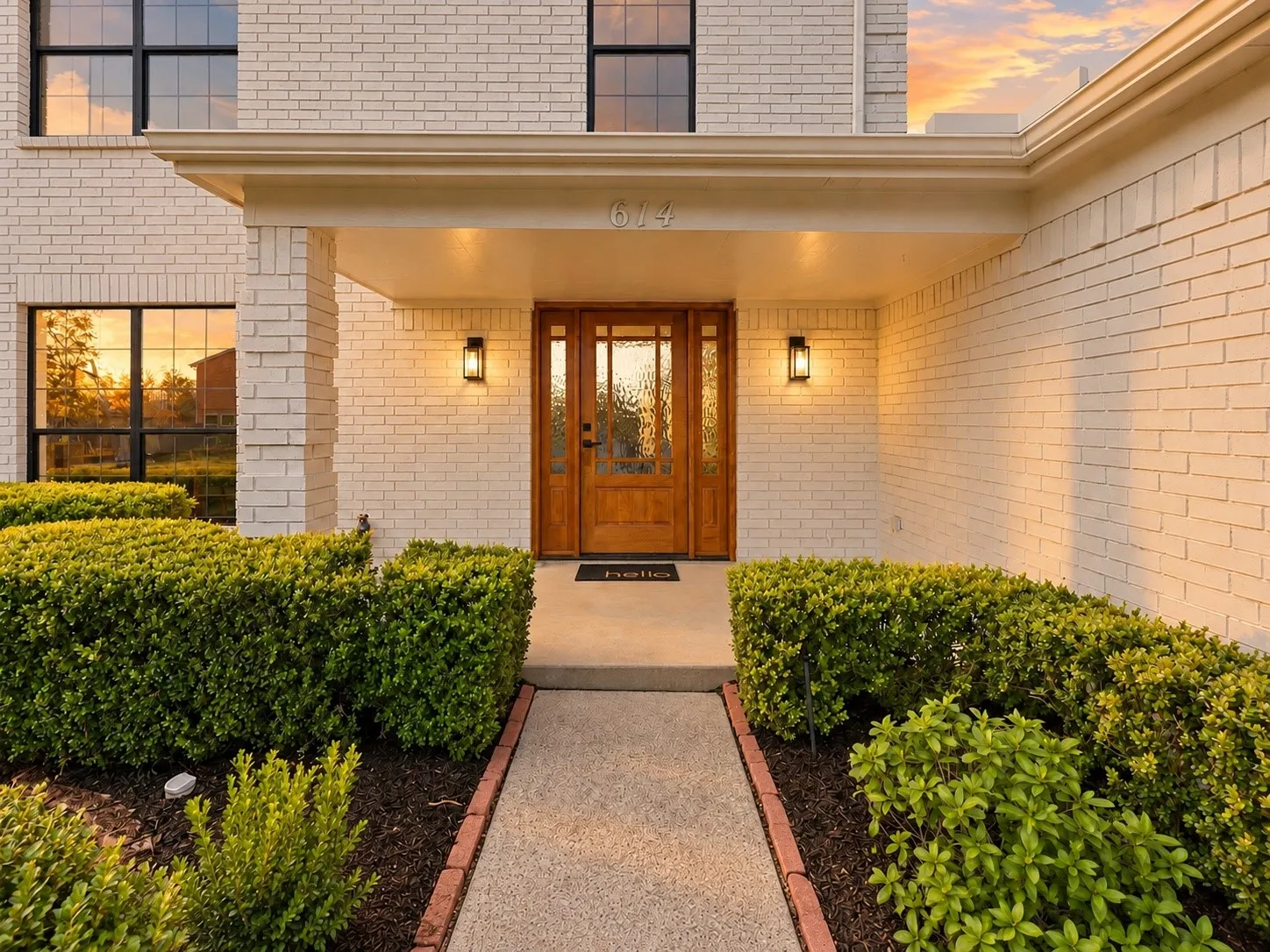 Brick exterior facade with black-framed windows