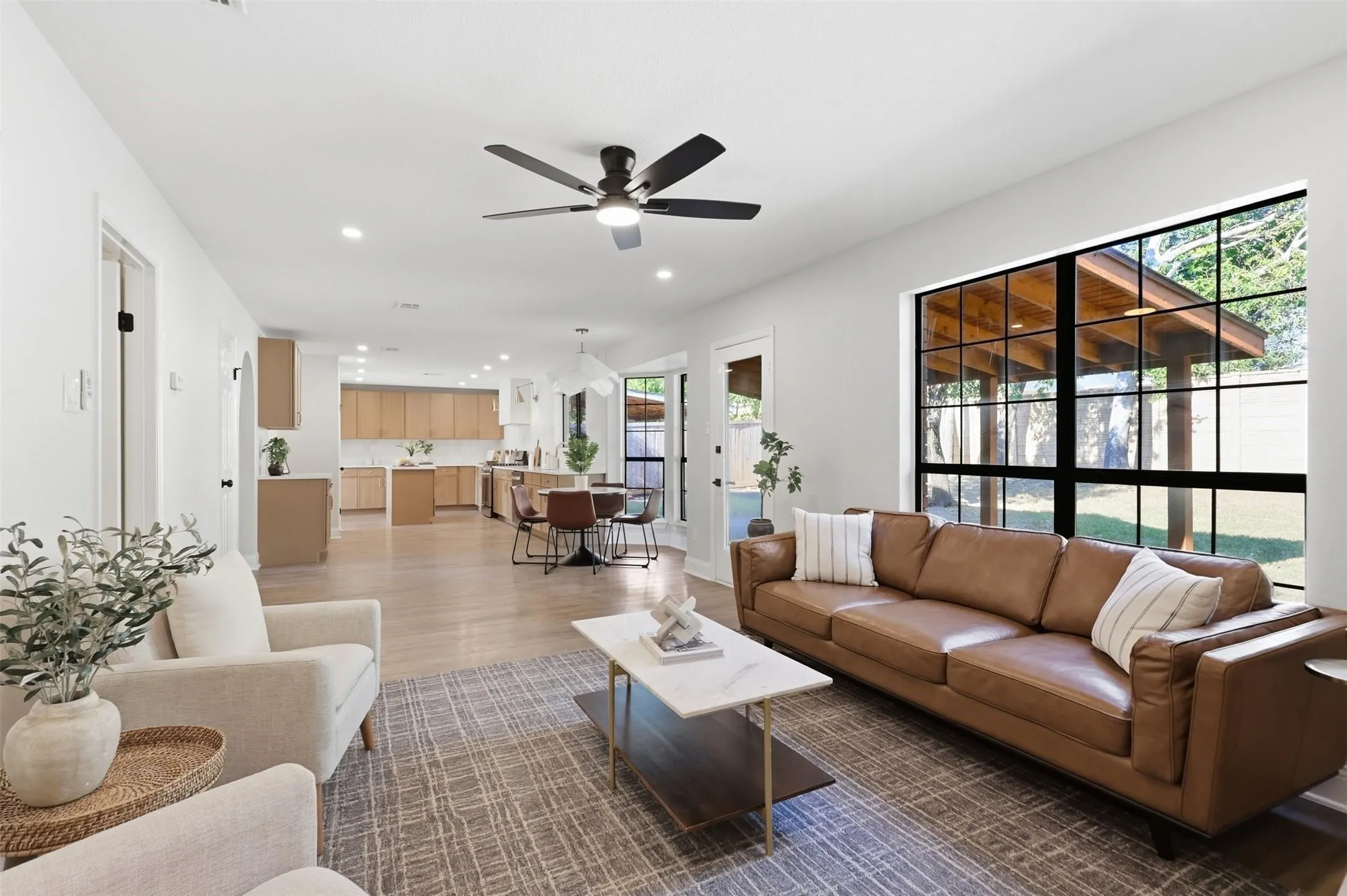 Open-concept living area with wood-finish flooring