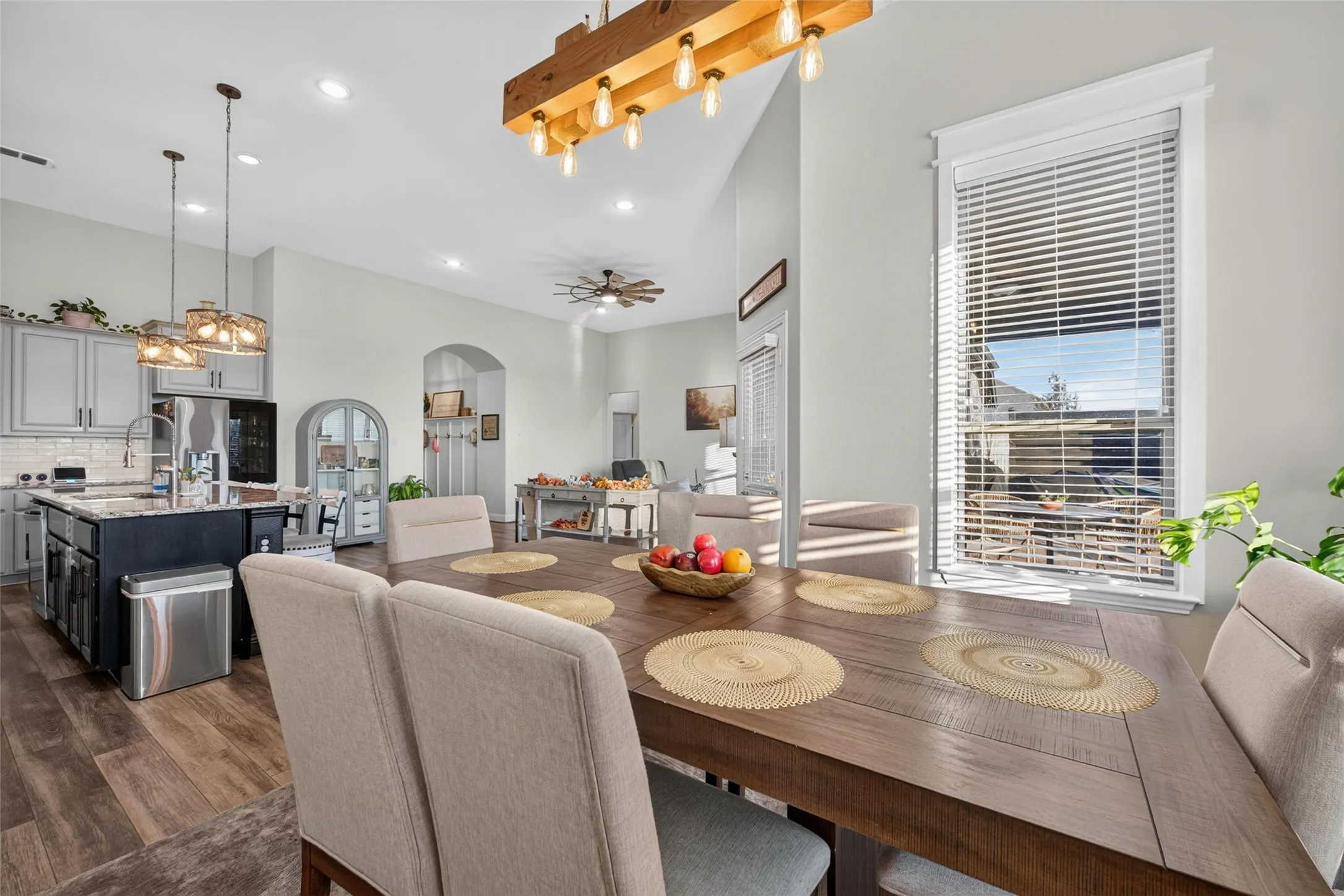 Open-concept living space with wood-finish flooring