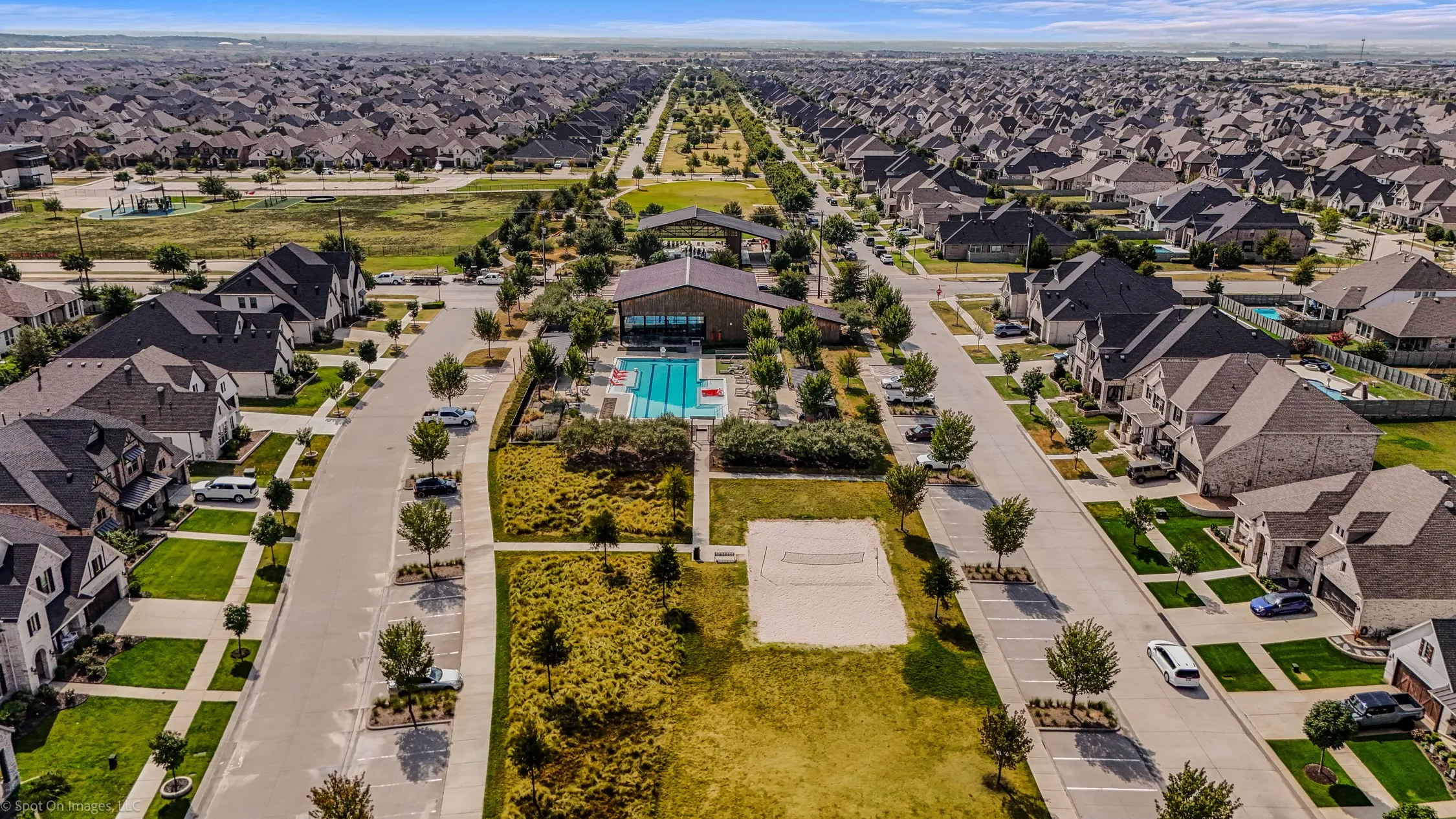 Pool with sand volleyball courts in the Amenity Center North located in Argyle, Texas in Harvest by Hillwood for 1302 20th St. in Denton County. Both of these amenity centers have state of the art workout centers.