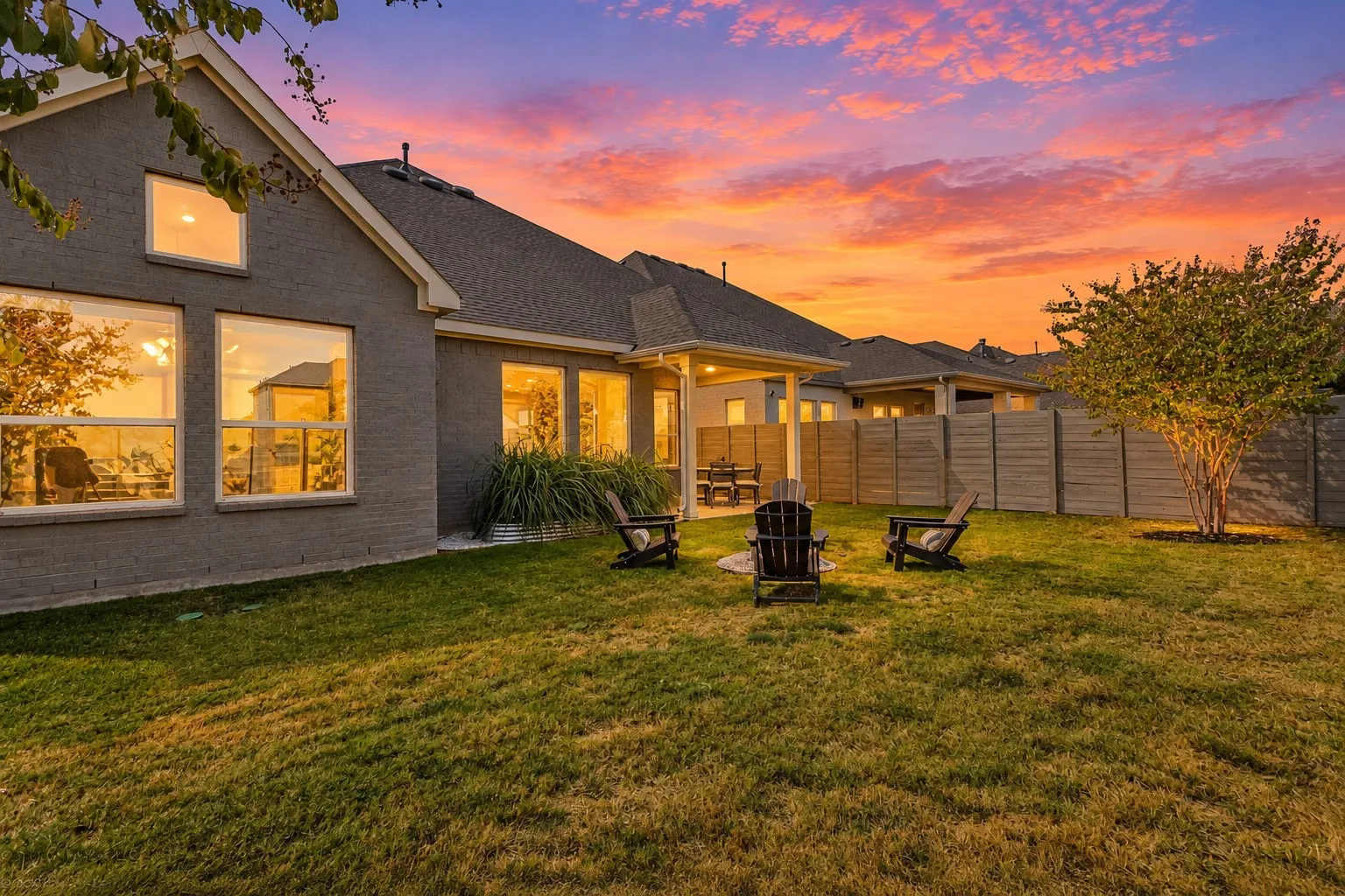 Sunset on the back of home of 1302 20th St, Argyle, TX in Harvest by Hillwood