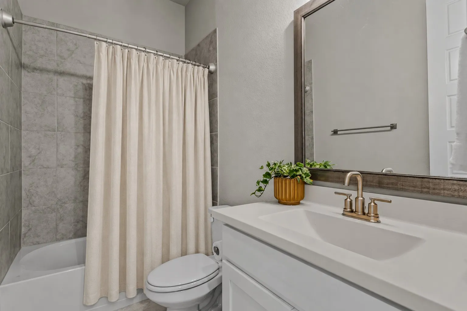 Downstairs full bathroom of 1302 20th St, Argyle, TX in Harvest by Hillwood