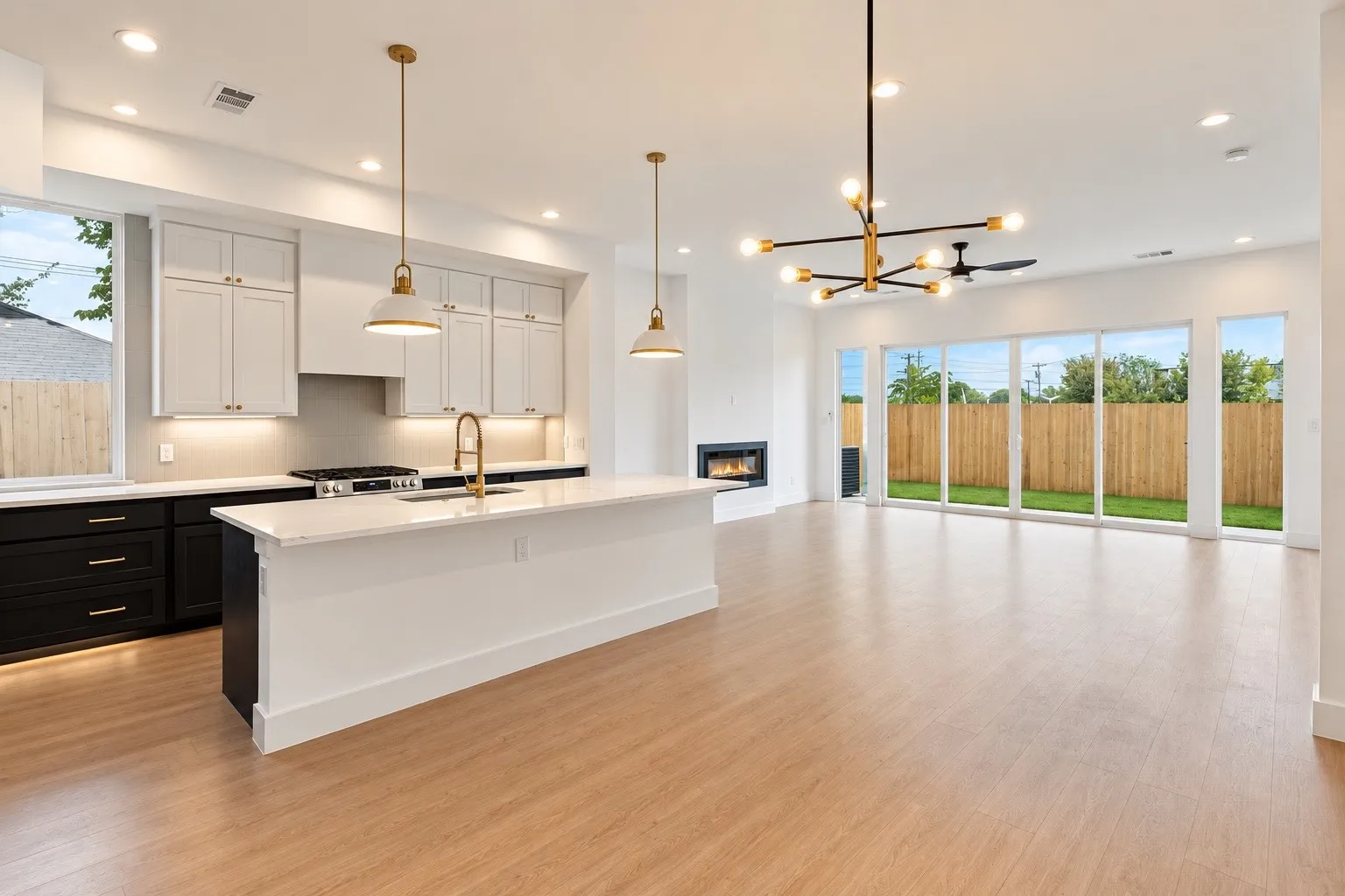Open-concept living space with wood-finish flooring