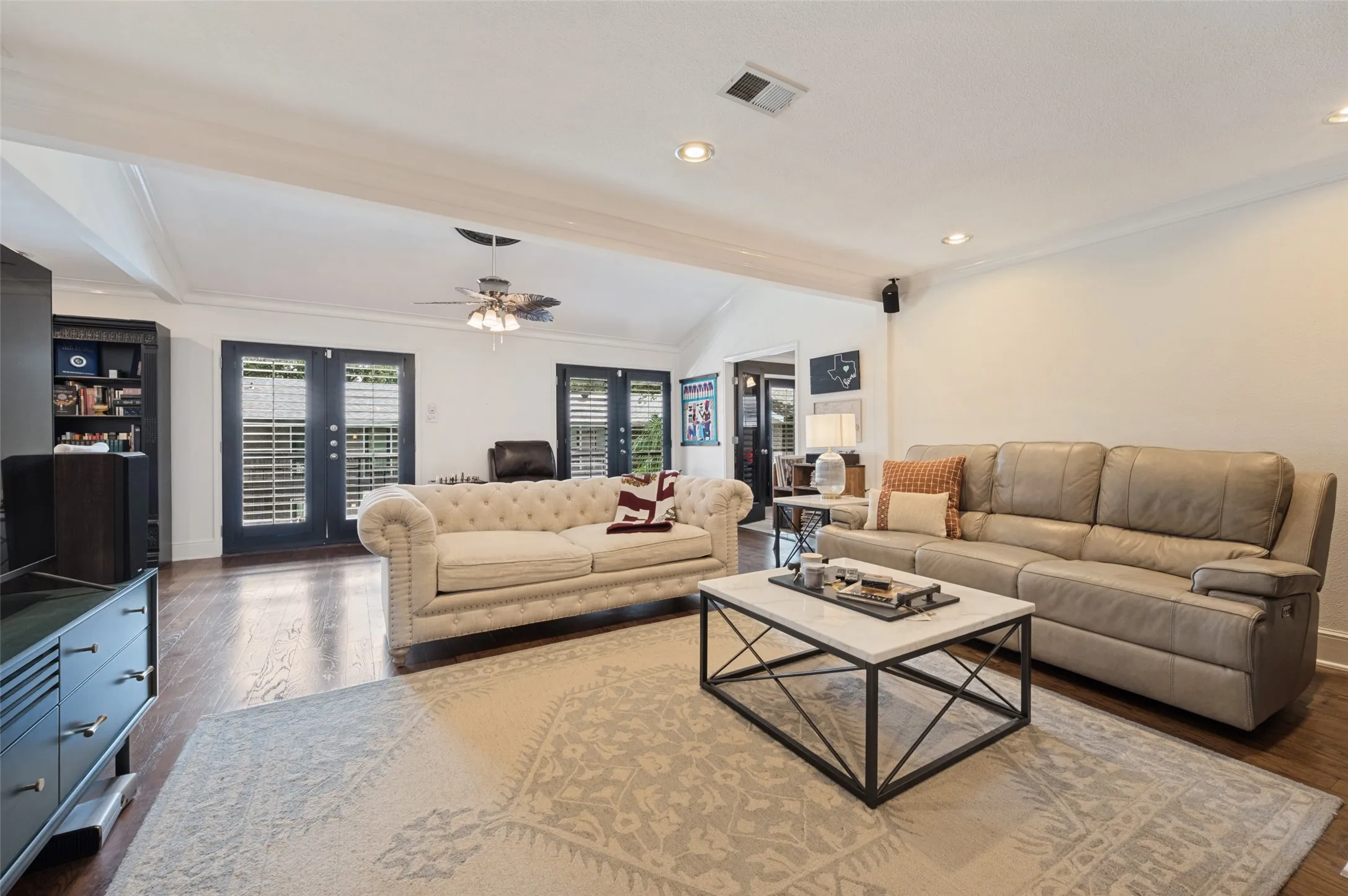 Wood-finish flooring, recessed lighting, and a ceiling fan