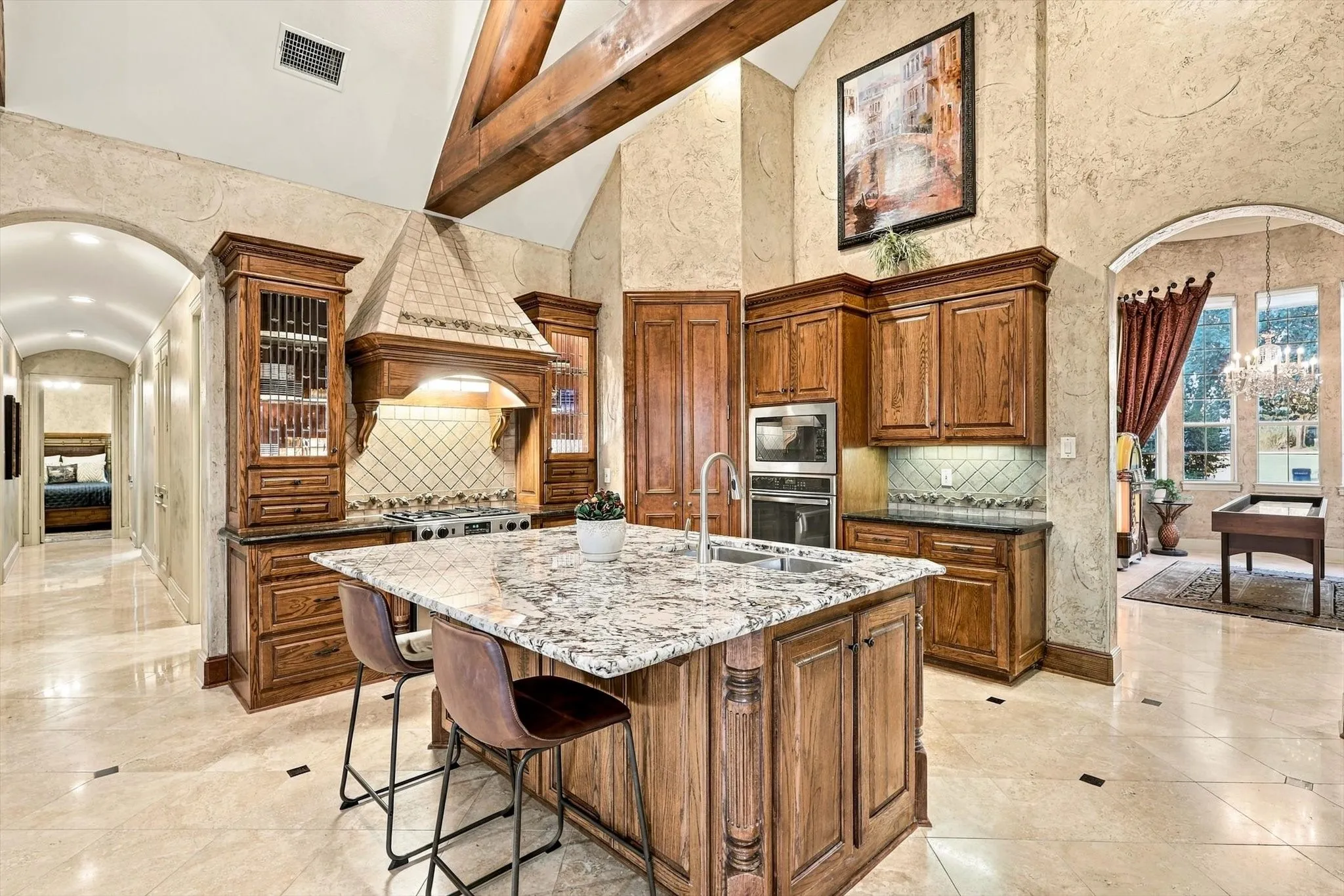 Rich in character and craftsmanship, this distinguished study features coffered ceilings, a built-in desk, leaded-glass cabinets and thoughtful details throughout.