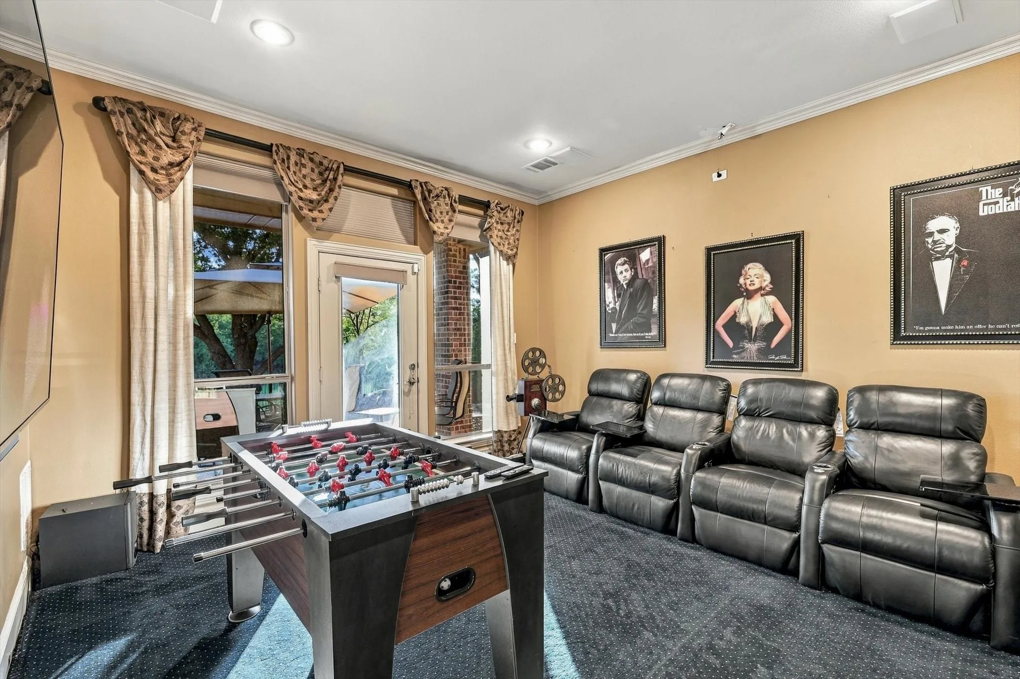 A media room just steps from the great room creates a dedicated space for movie nights, game-day gatherings and evenings spent together.