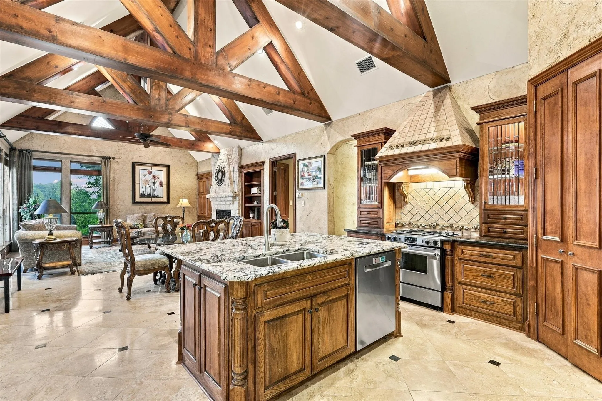 The kitchen and great room are anchored by dramatic beams that bring warmth, character and a touch of luxury mountain-lodge charm to the heart of the home.