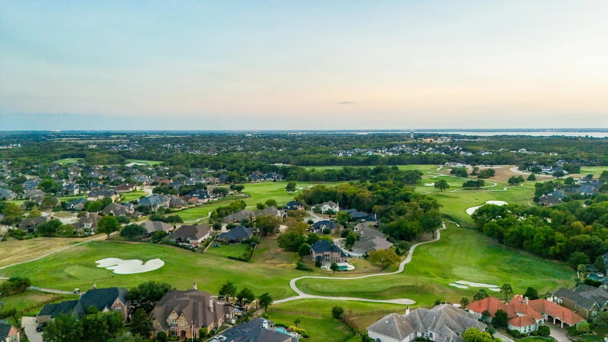 From above, take in the scenic Buffalo Creek Country Club golf course and see just how close the home is to Lake Ray Hubbard and its many opportunities for outdoor recreation.