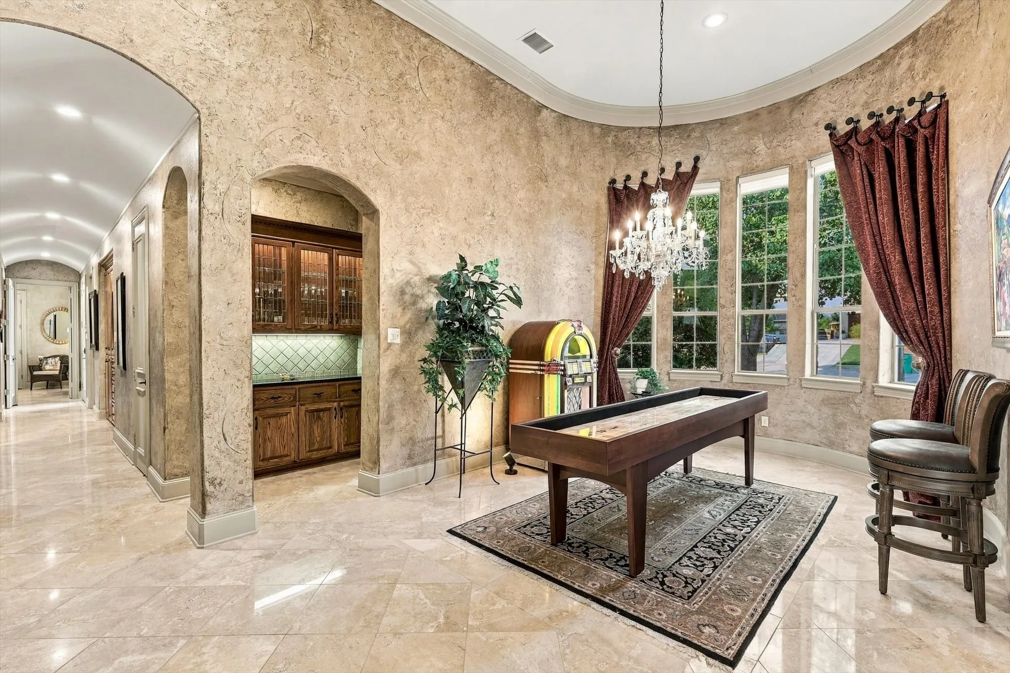 Adjoining the dining room, the butler’s pantry offers thoughtful storage and beautiful details, including lighted leaded-glass cabinets that provide the perfect showcase for dishes, glassware and entertaining pieces.