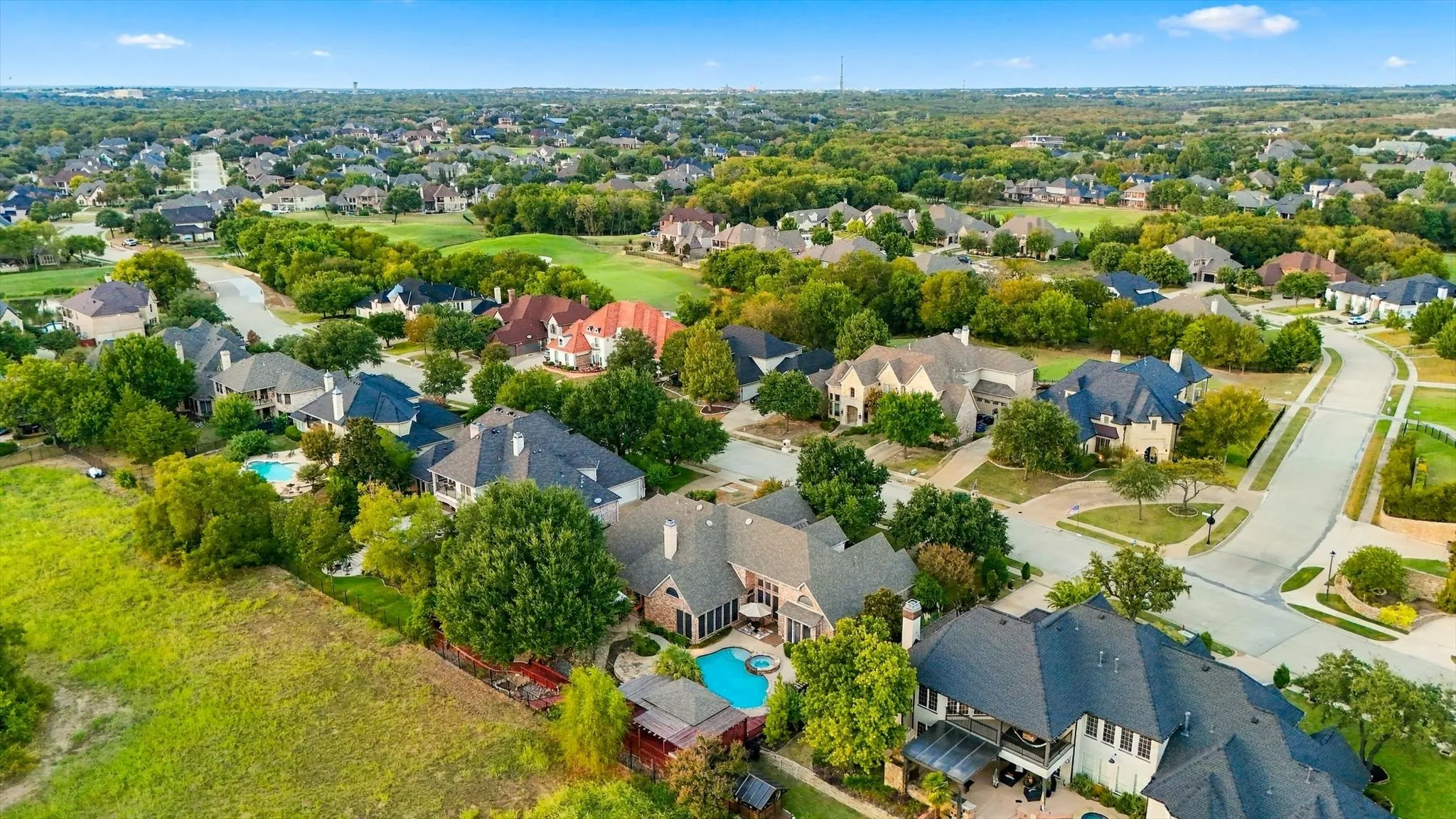 From above, you can truly appreciate the beautiful open greenspace beyond the backyard and the privacy it brings to this special setting.