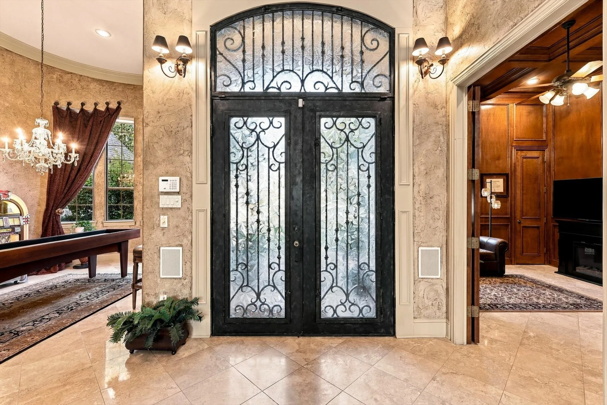 Step inside and immediately appreciate the open floor plan and thoughtful custom details, from beautiful, easy-care travertine flooring to crown molding throughout.
