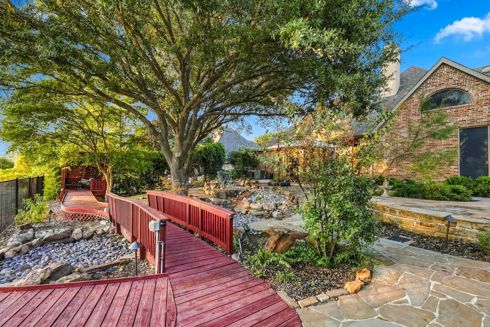 A winding path leads to a secluded swing where you can slow down, relax and take in the sunset from your own private outdoor retreat.