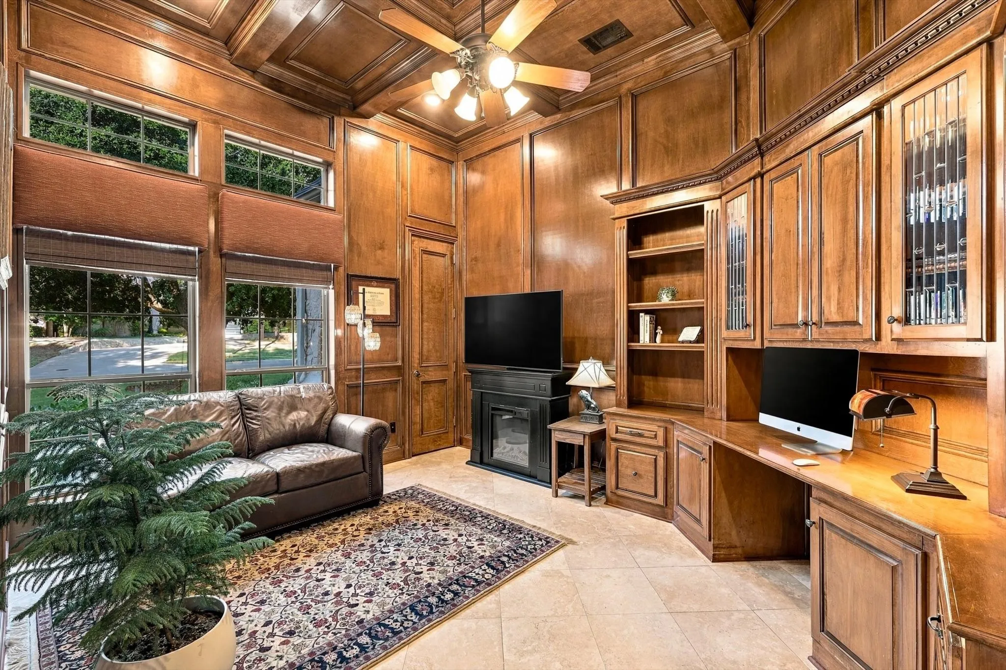 Rich in character and craftsmanship, this distinguished study features coffered ceilings, a built-in desk, leaded-glass cabinets and thoughtful details throughout.