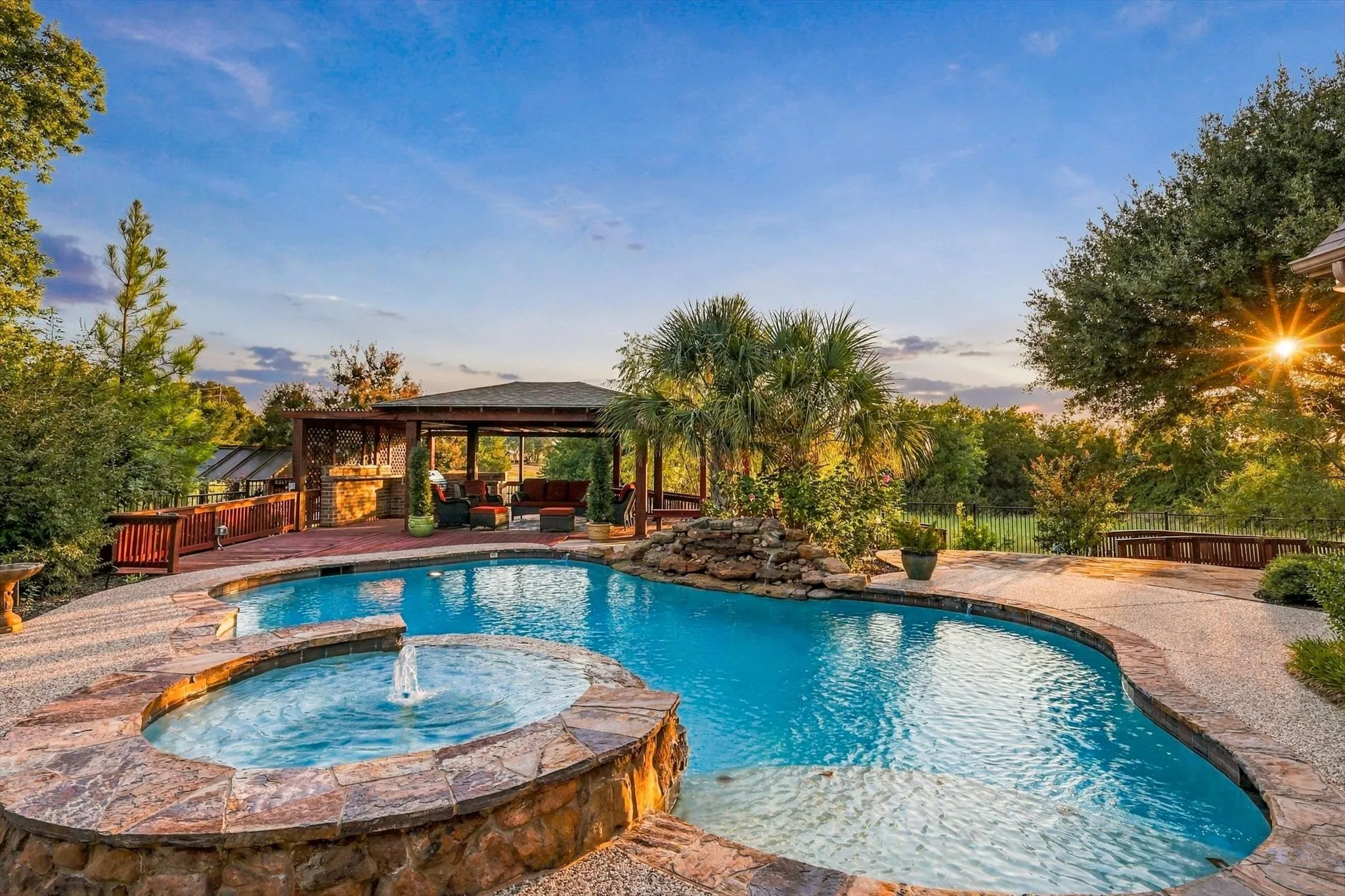Step outside to your own resort-style backyard, where a pool and spa are surrounded by mature trees and lush landscaping, with plenty of spaces to relax, entertain and enjoy long afternoons outdoors.