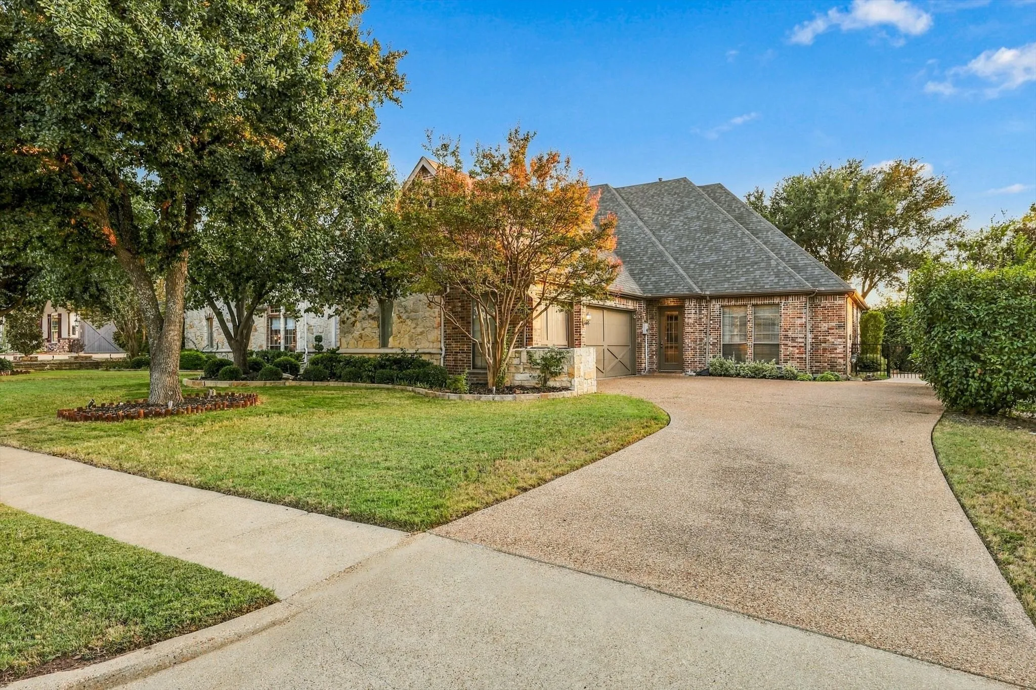 A wide swing driveway and three-car garage provide exceptional parking space, making it easy to accommodate large vehicles and visiting guests.