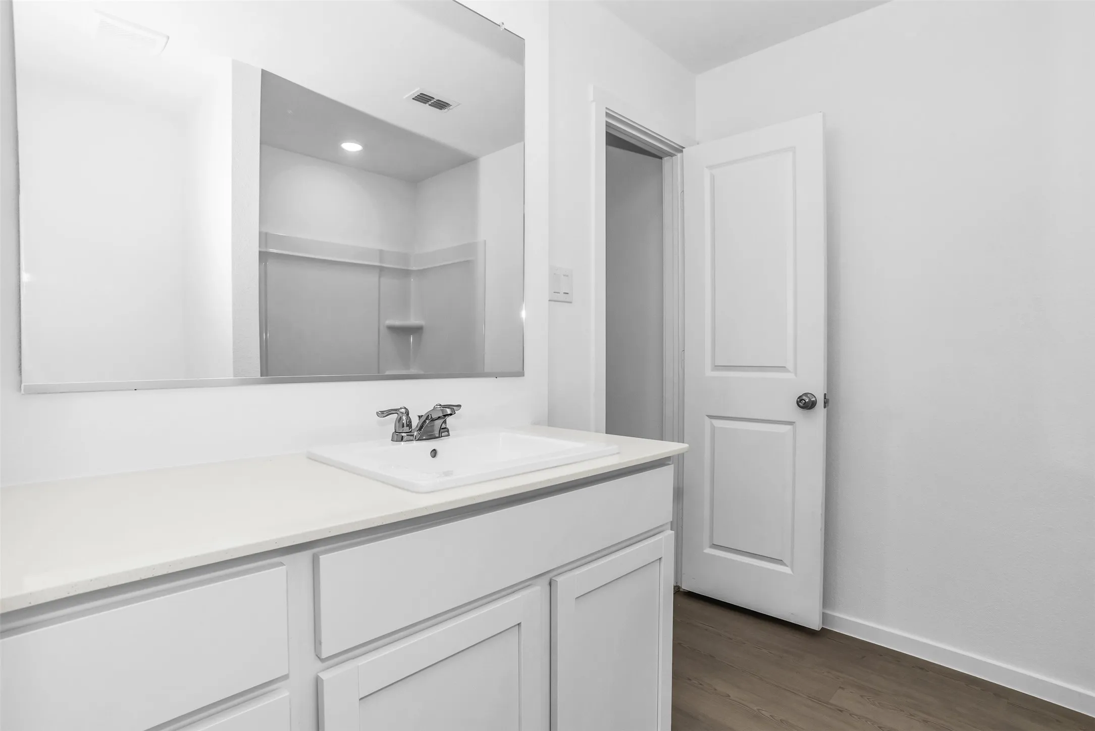 Bathroom with vanity and dark wood finished floors