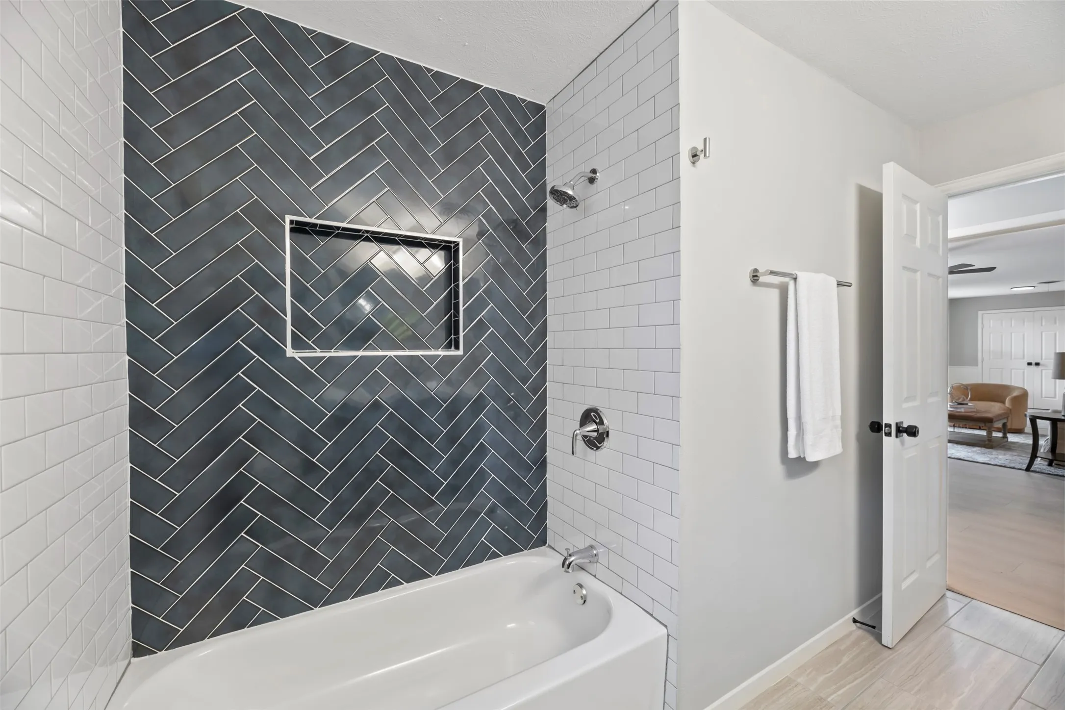 Hall bathtub, tile surround and faucet are all new