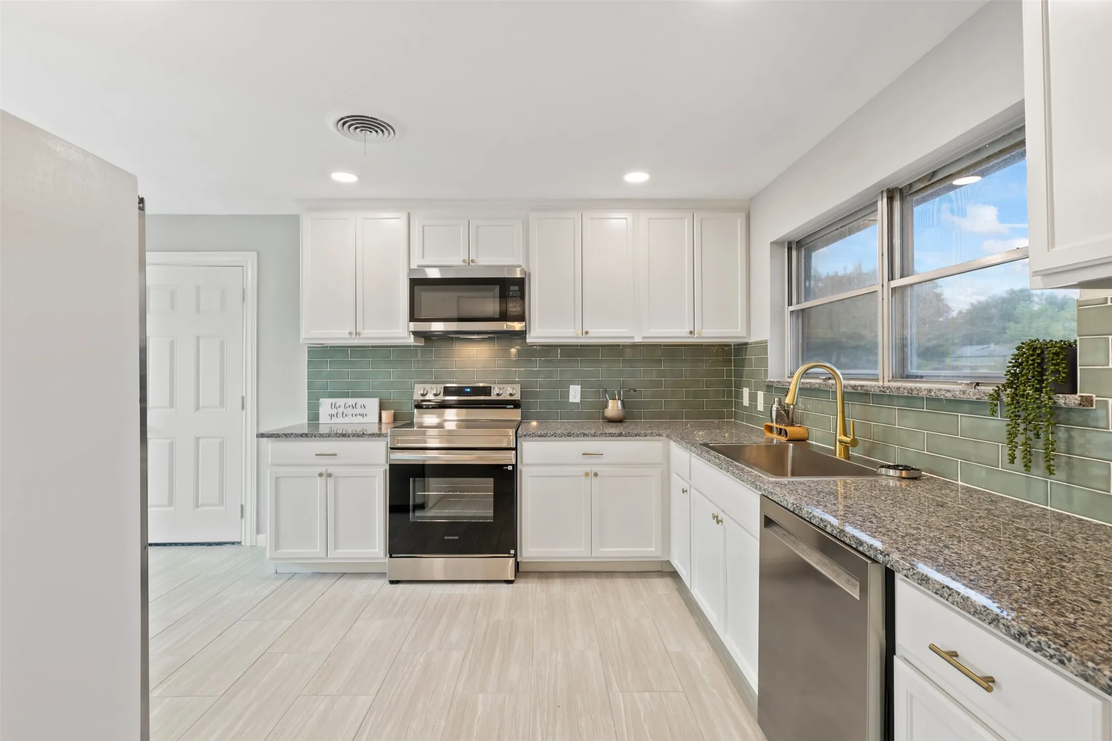 Kitchen has new cabinets, back splash and stainless appliances