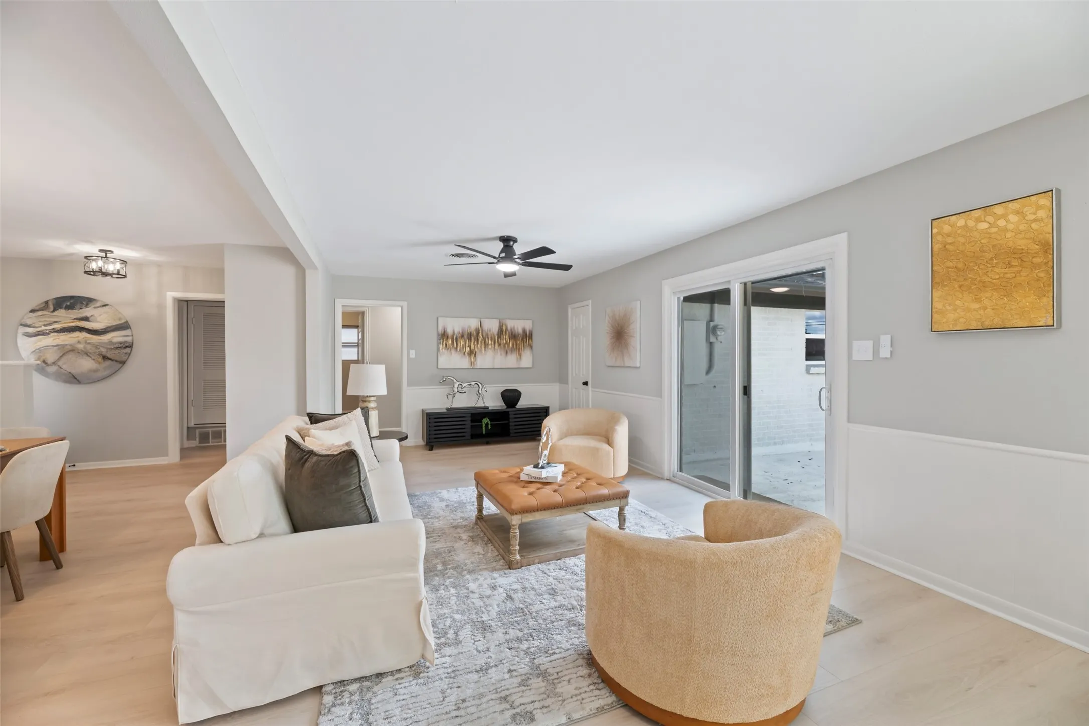 The open floor plan is flexible offering either two living spaces or two dining spaces