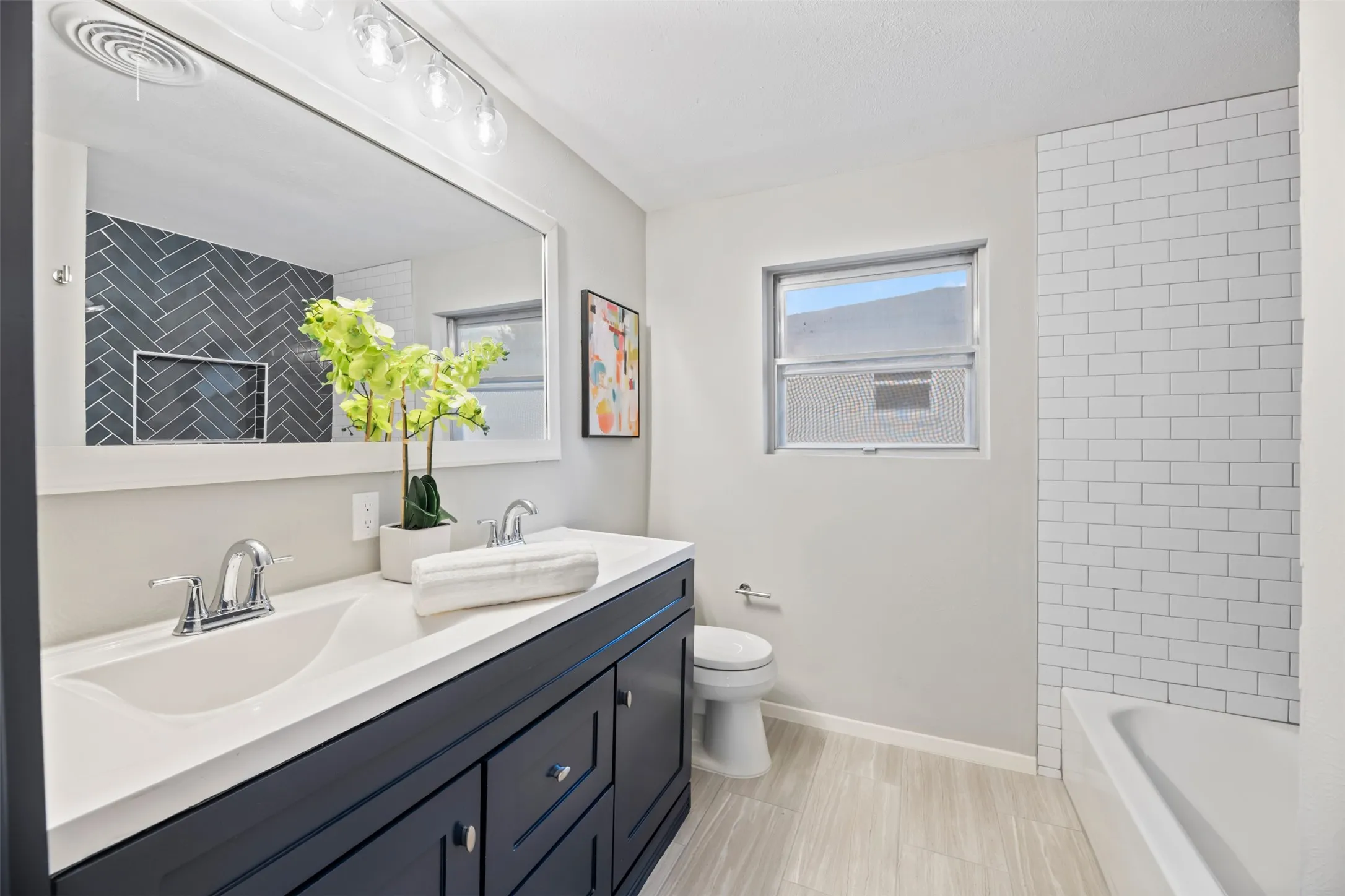 Hall bathroom has a dual sink​​‌​​​​‌​​‌‌​‌‌​​​‌‌​‌​‌​‌​​​‌​​ vanity