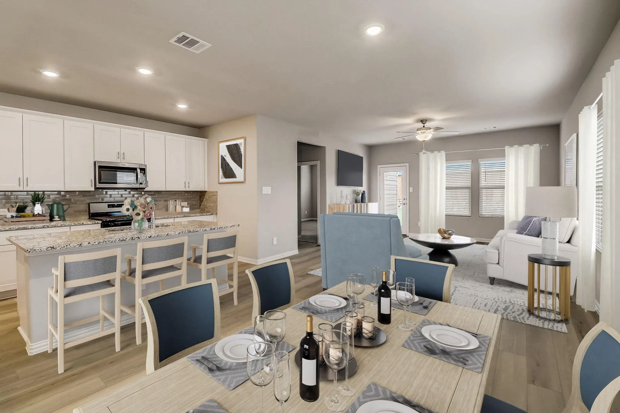 Open-concept living area featuring wood-finish flooring throughout