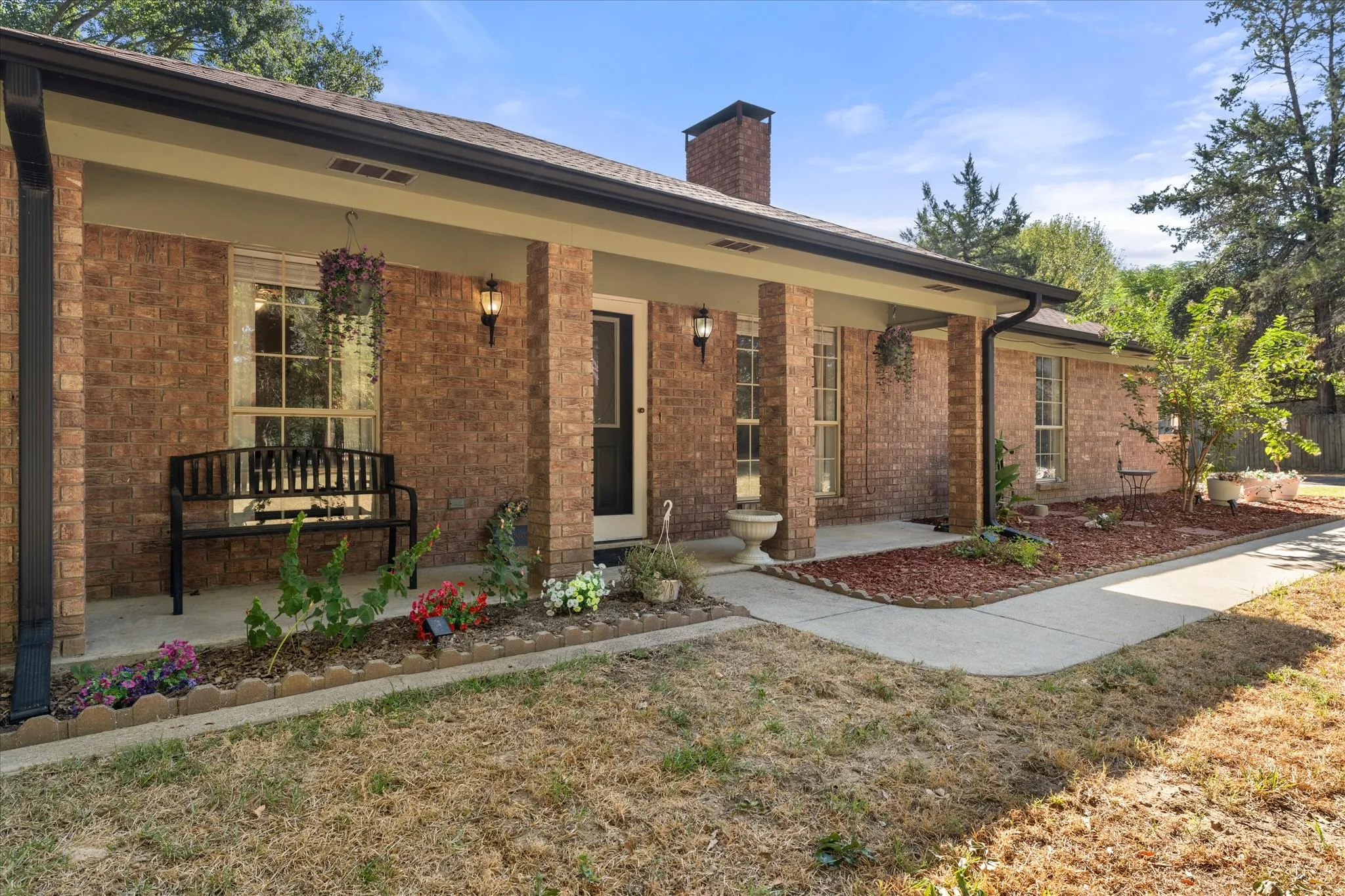 Great Front Porch with Manucured Flower Beds