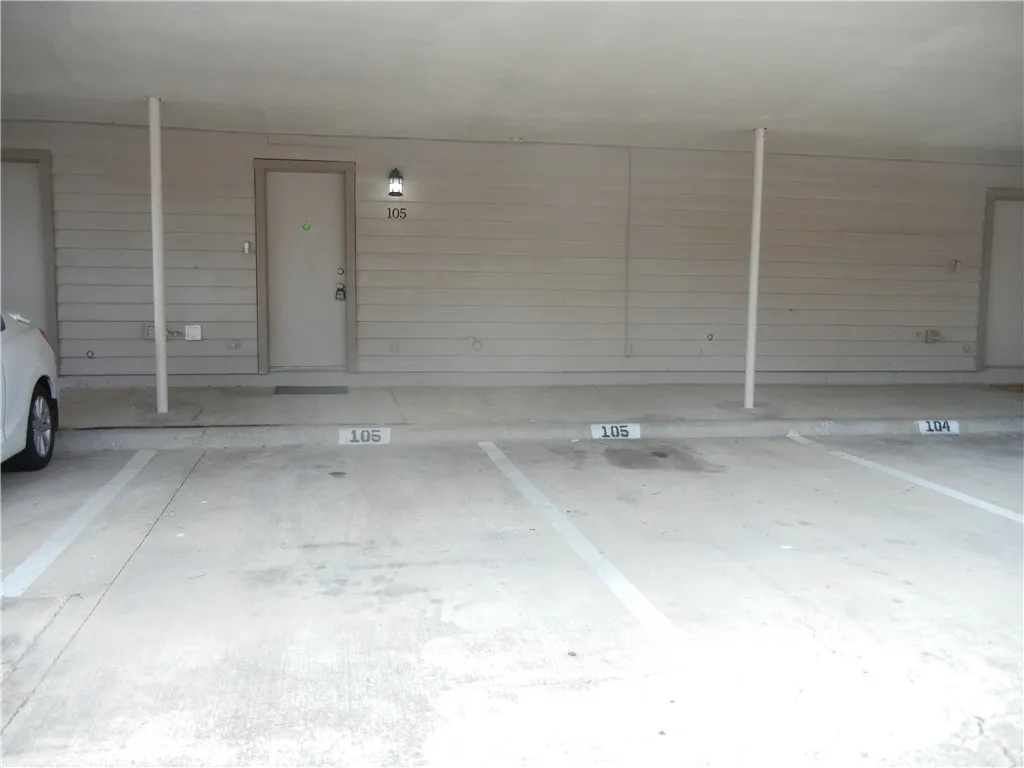 Rear Entrance with 2 parking carport spaces attached to unit