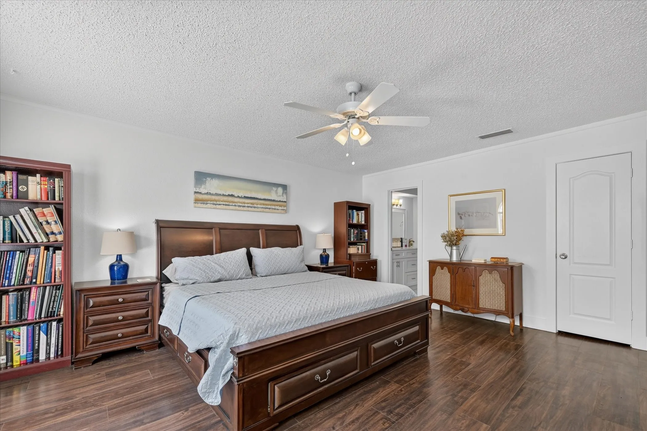 Primary bedroom with walk in closet and nice natural light