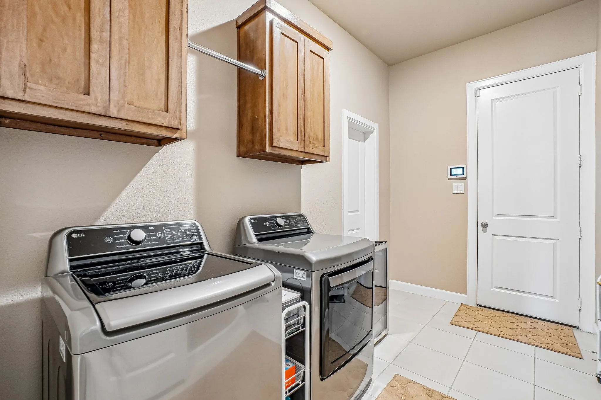 Over sized laundry with access to primary closet & garage