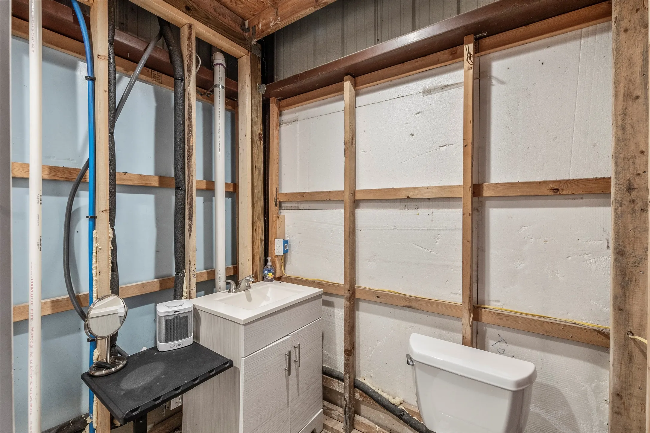 Sink and toilet and metal building