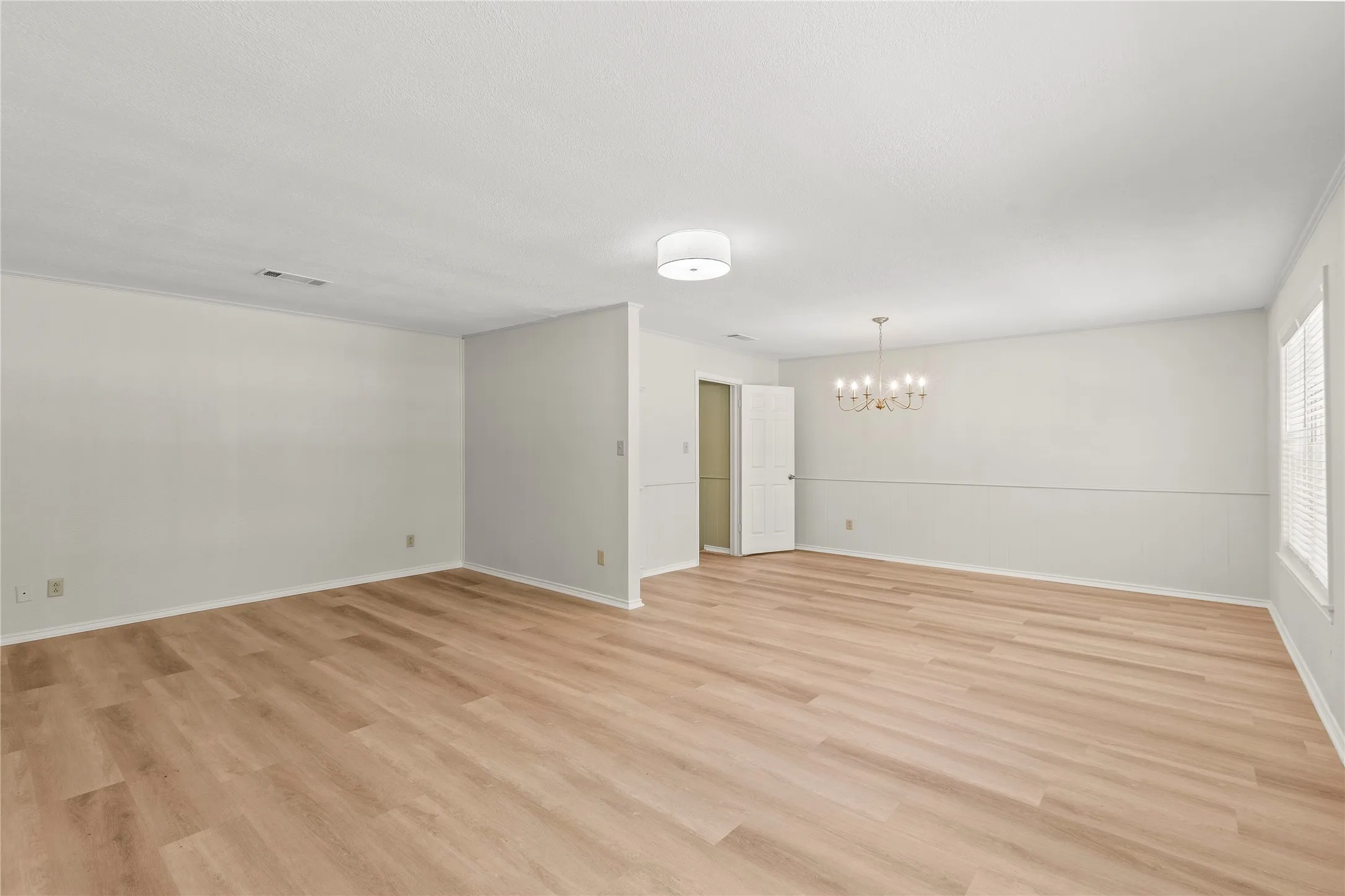 Formal living and dining room or could be game room