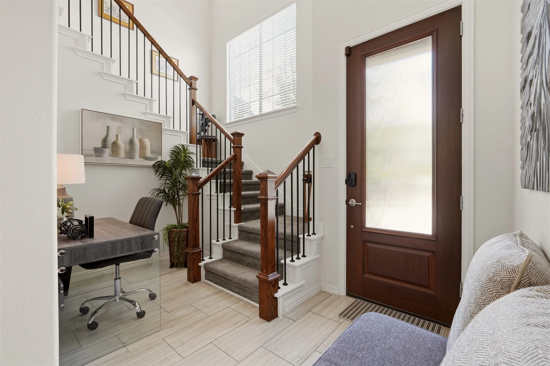 Wood-finish entry door with a privacy glass insert