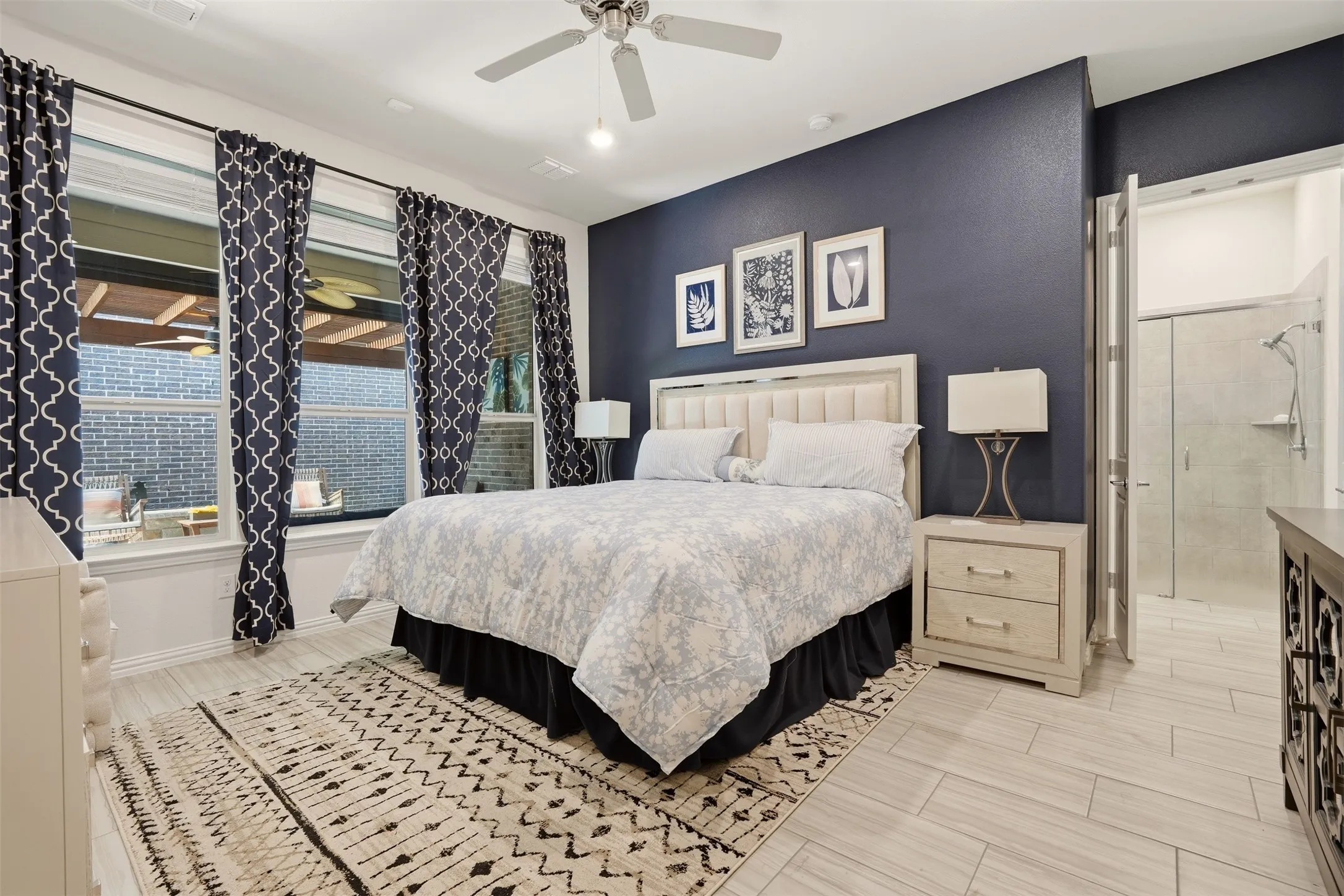 Recessed lighting, ceiling fan, large windows, and light wood-finish flooring