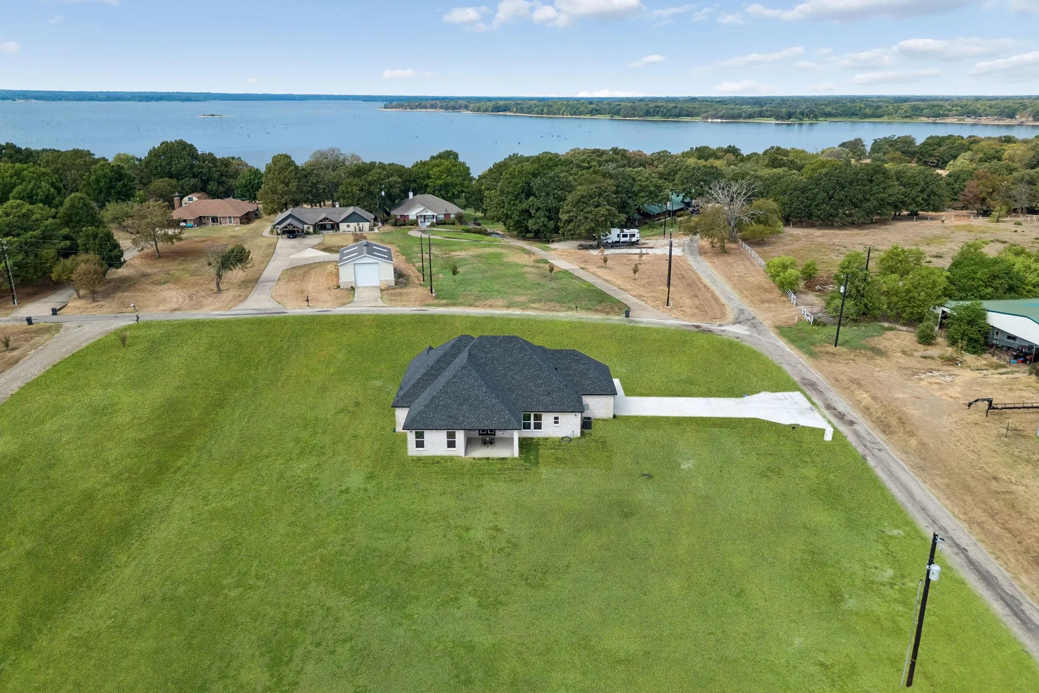 Newly constructed residence with a covered back porch near the lake
