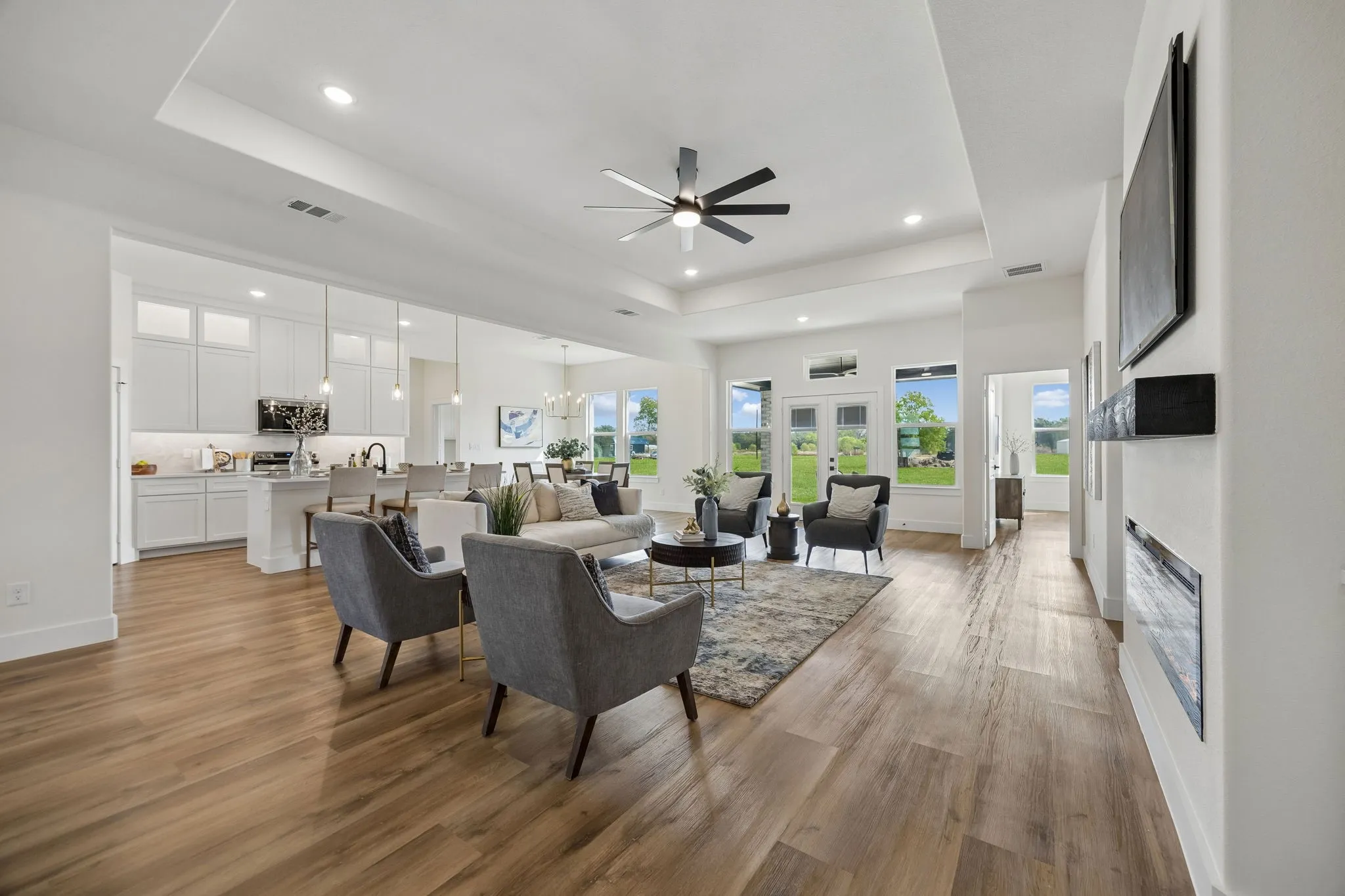 Open-concept living area with the living room and kitchen