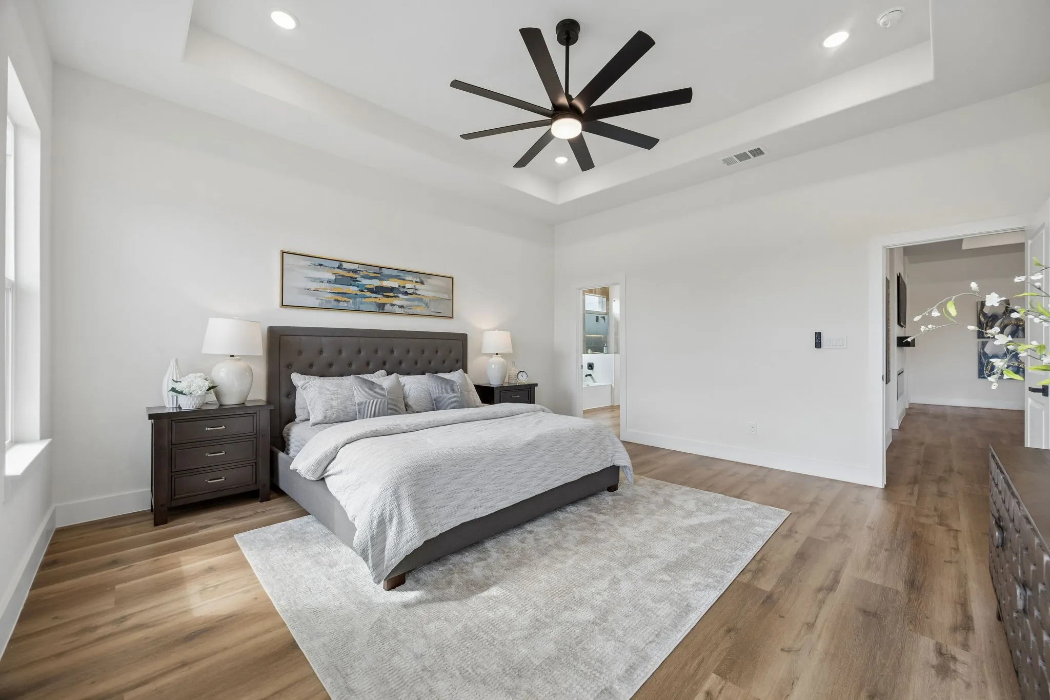 Another view of the primary bedroom