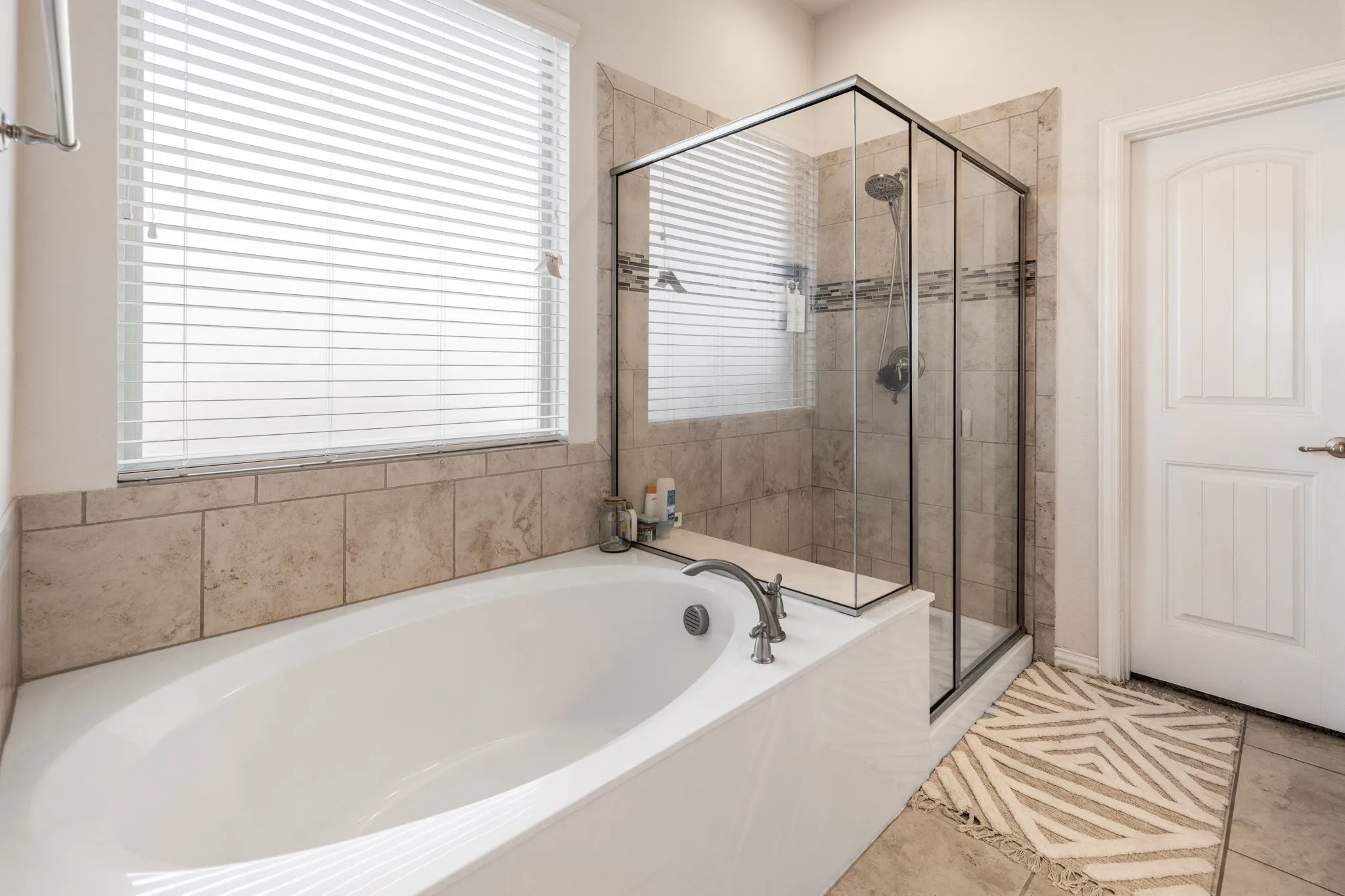 Soaking tub with deck-mounted faucet