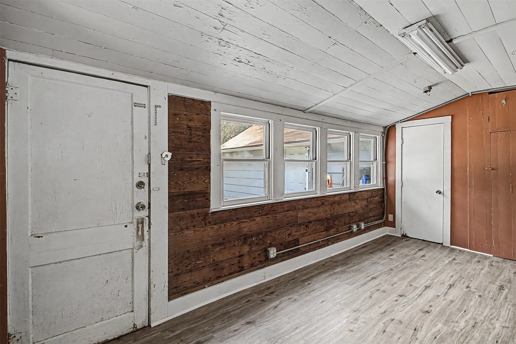 Second living/office/flex room located off the kitchen. Backyard access & Closet storage.