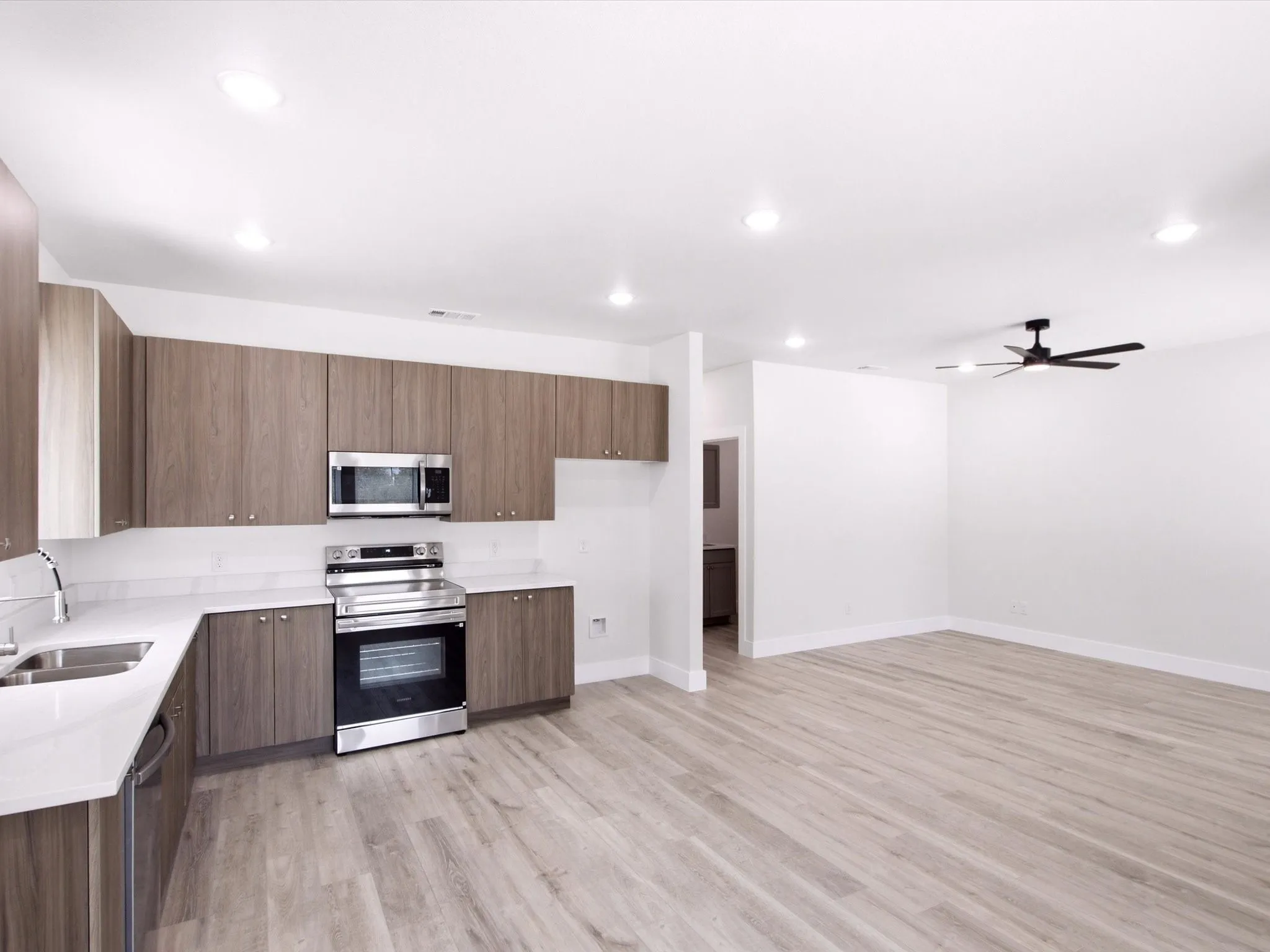 Modern kitchen with wood-finish cabinetry and stainless steel appliances
